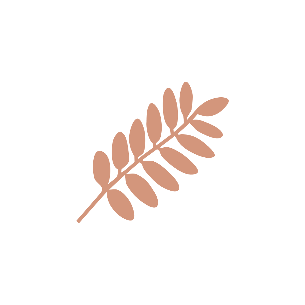 Modern building with wooden and white exterior, large glass window, set against a mountainous landscape.