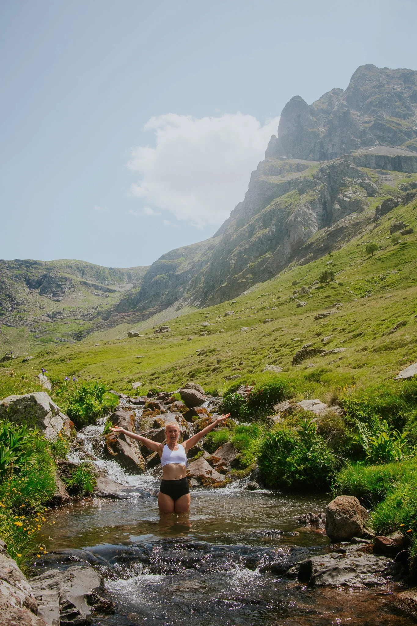 Woman feeling free in the river on a mountain