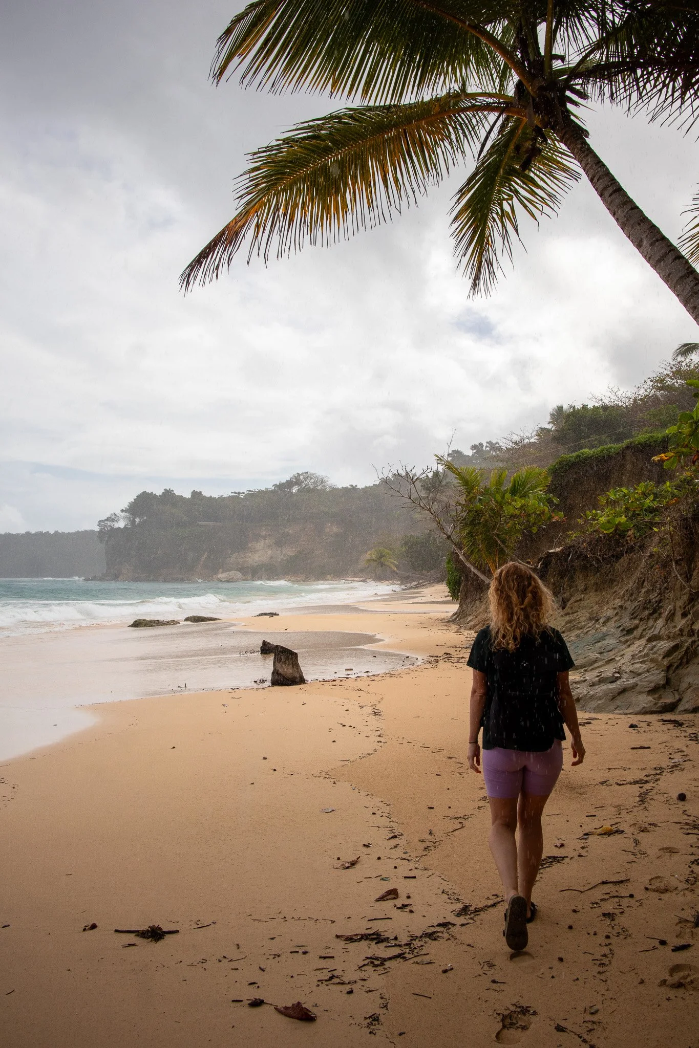 Woman walking on a tropical beach
