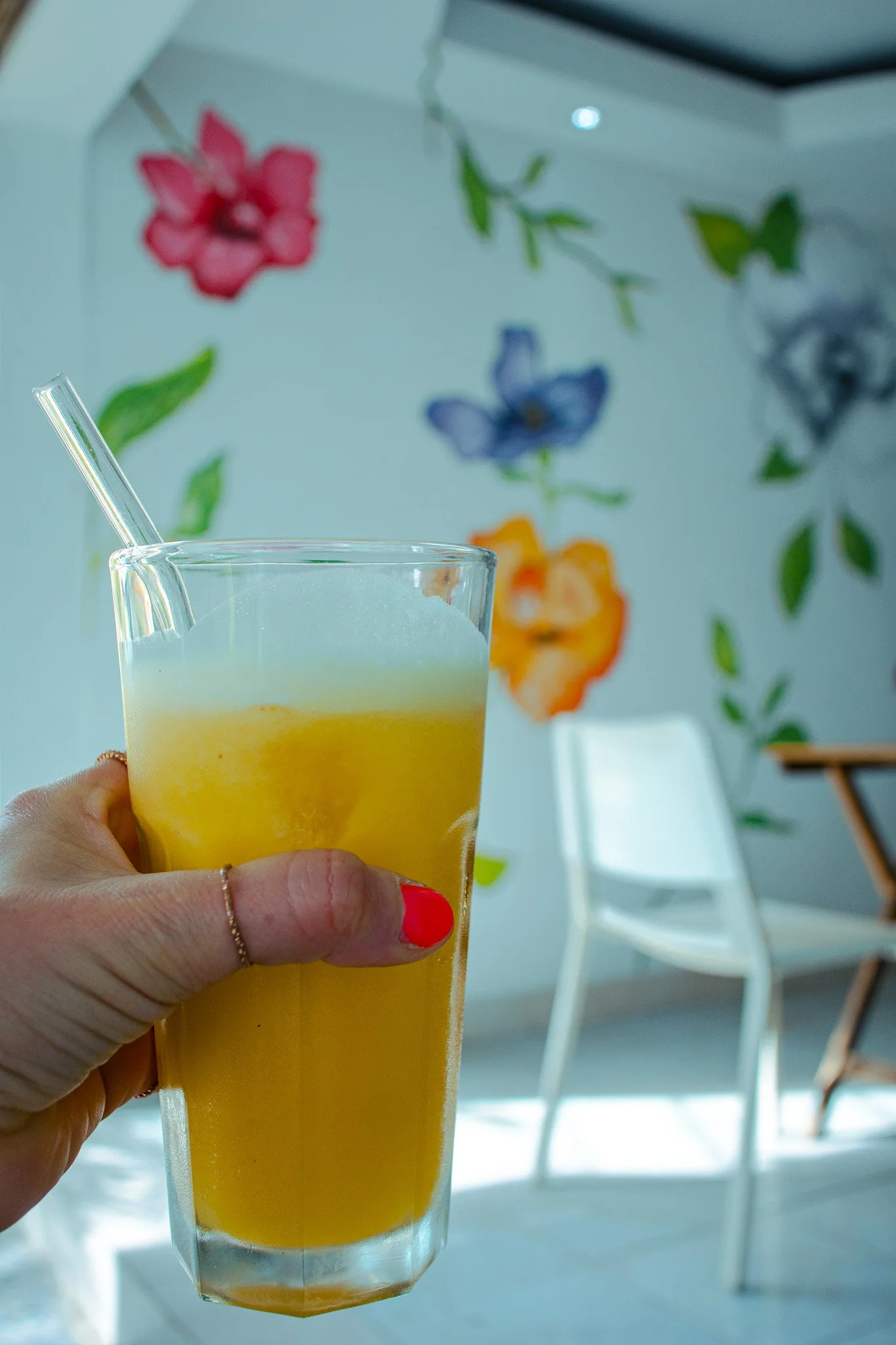 Freshly squeezed orange juice with a flower background