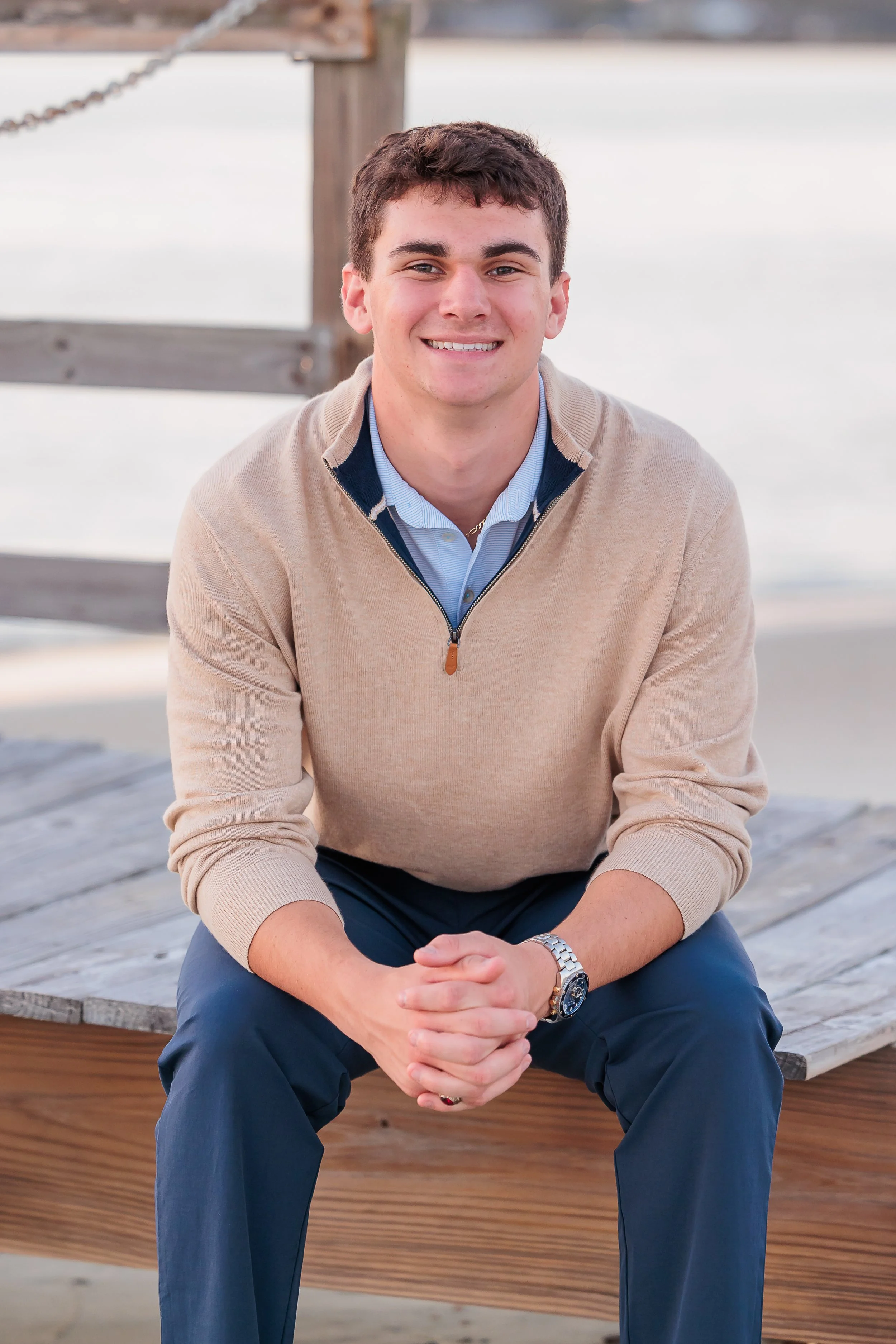 Tybee Island, GA, Senior Portrait Photographer, Lisa Barksdale, a senior boy sitting on a dock.