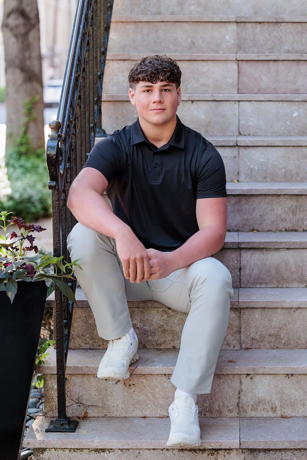Savannah, GA, Senior Portrait Photographer, Lisa Barksdale, a senior boy sitting on steps Downtown.