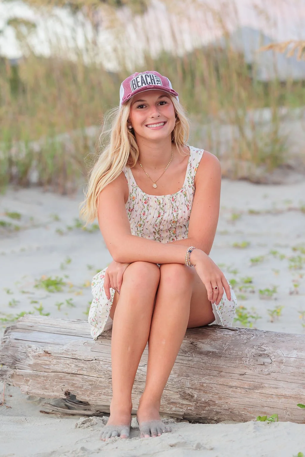 Tybee Island, Georgia, Senior Portrait Photography, Lisa Barksdale, a girl sitting on driftwood.