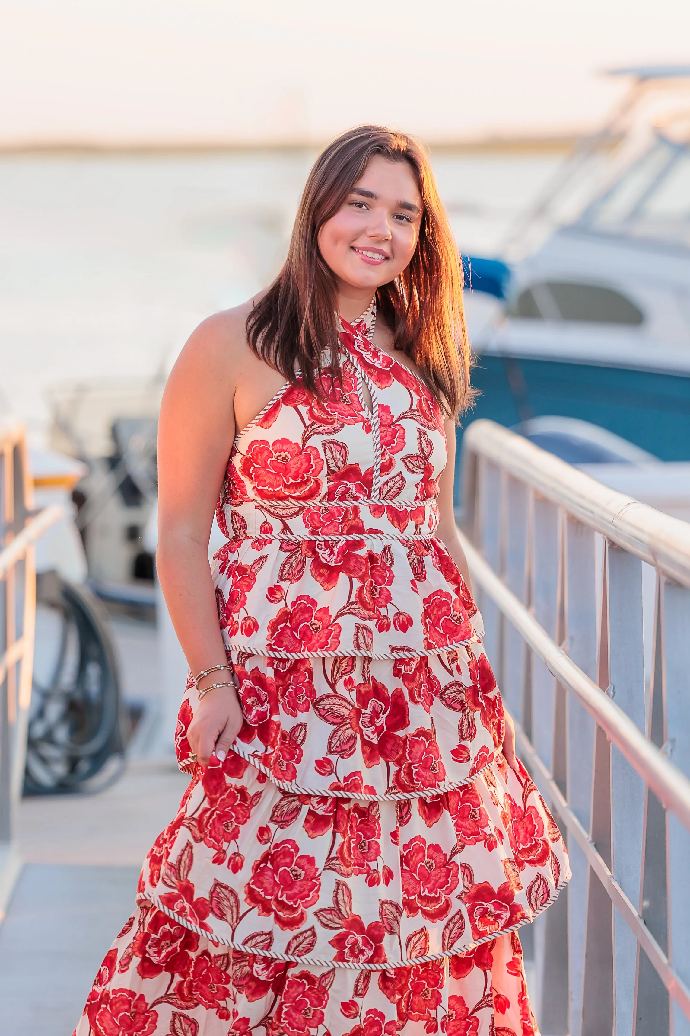 Savannah, Georgia, Senior Portrait Photography, a senior girl in a long pink dress on the dock. 