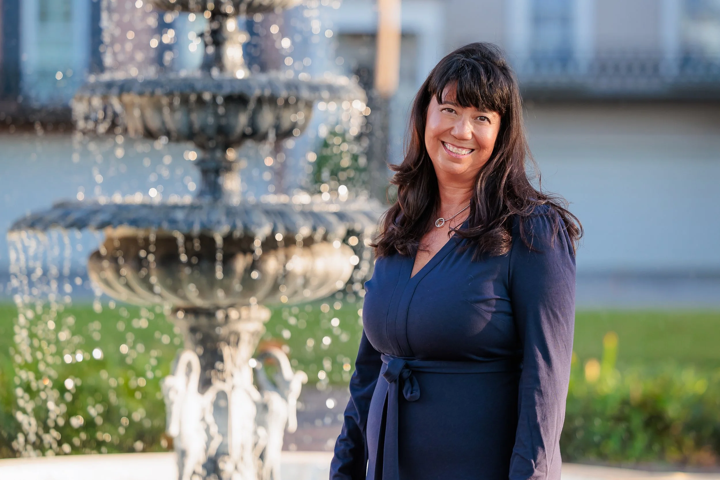 Savannah, GA, Professional Headshot Photographer, Lisa Barksdale, a woman staying by a fountain. 