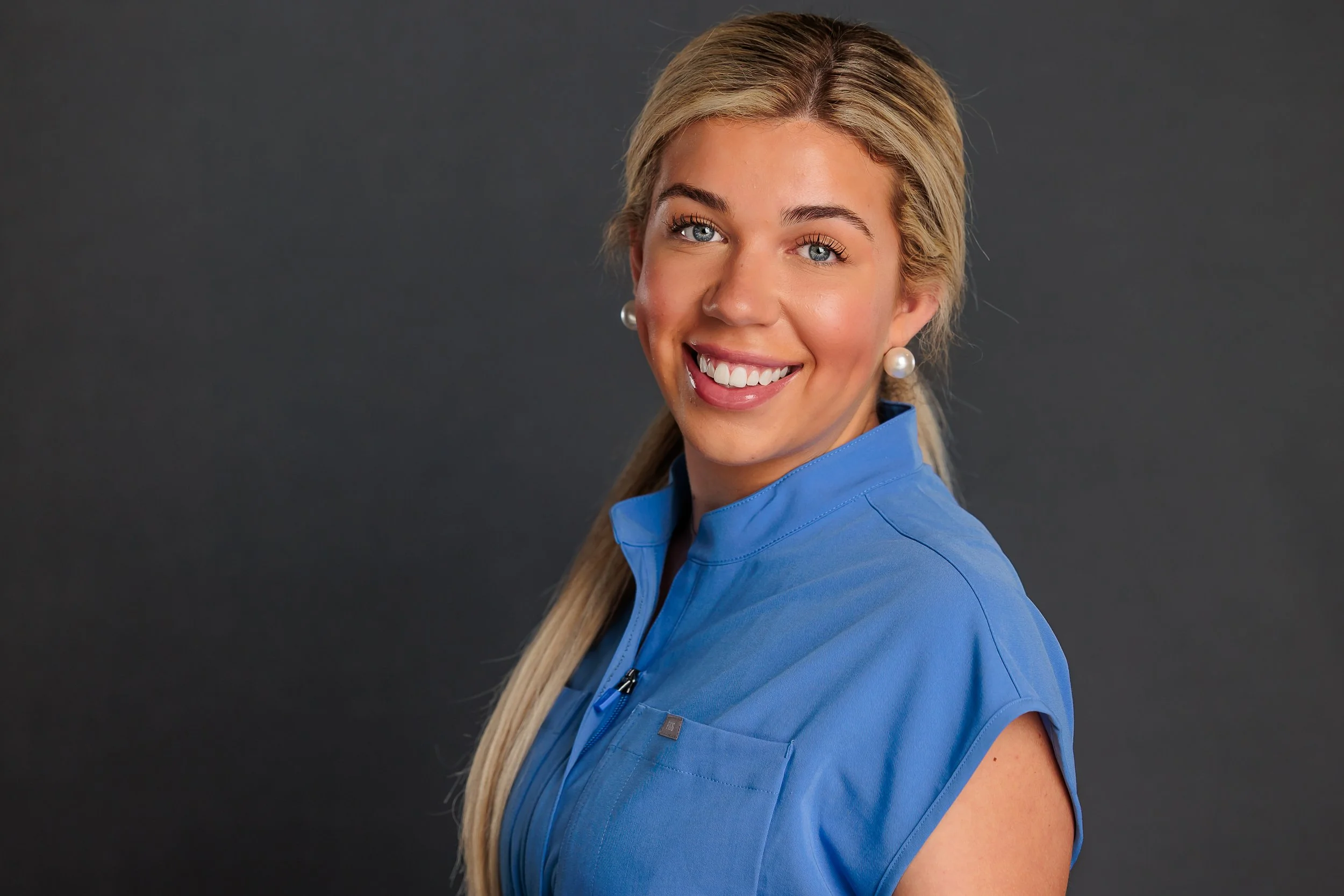 Savannah Professional Headshot Photographer, Lisa Barksdale, a medical student with solid backdrop. 