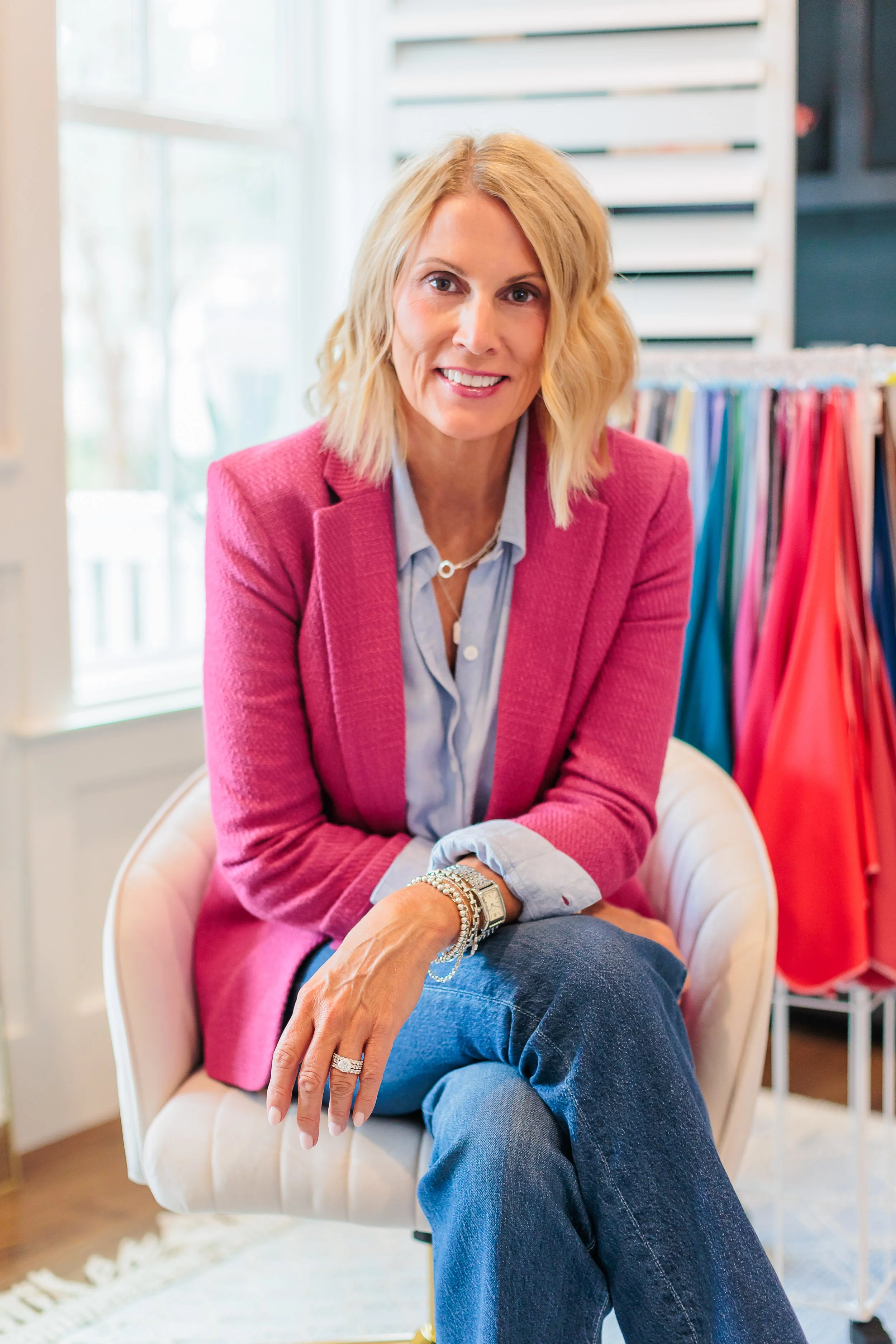 Savannah, GA, Professional Headshot Photographer, Lisa Barksdale, a woman sitting with a pink jacket on.