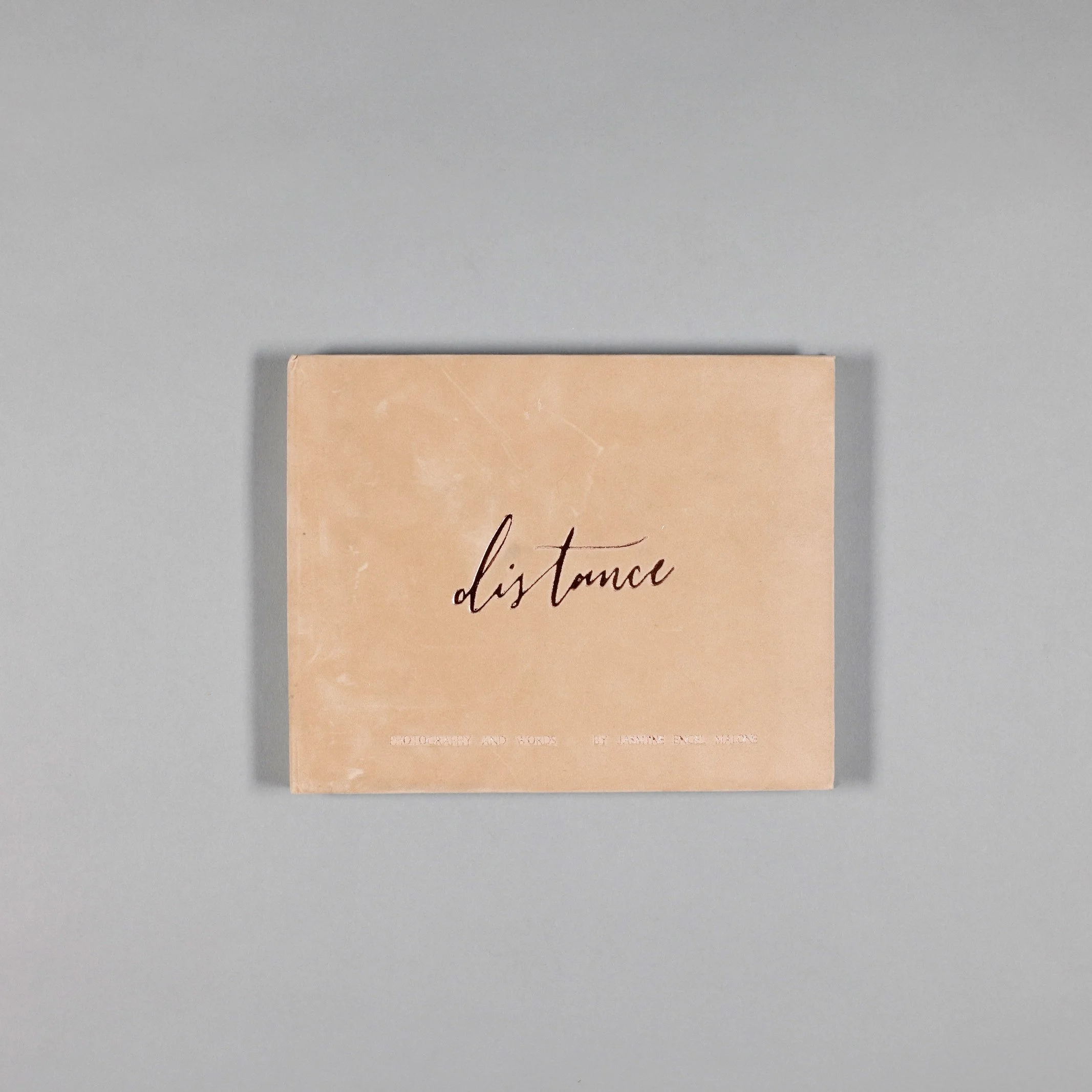 Handbound, Hardback edition. Suede cover and foiled embossing.