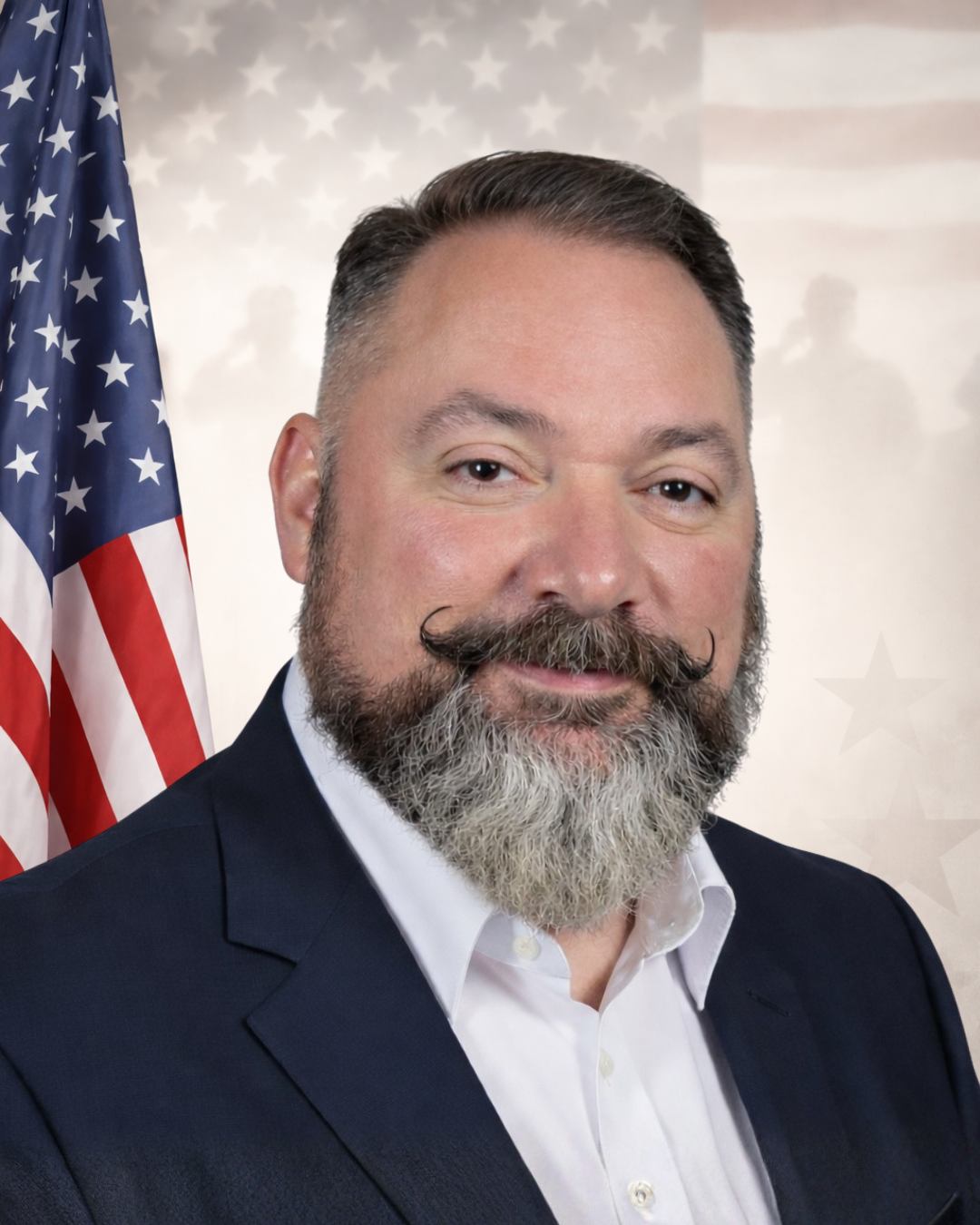 A man with a beard and the American flag.
