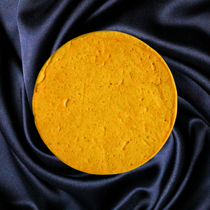 Aged Cheddar cheese wheel
