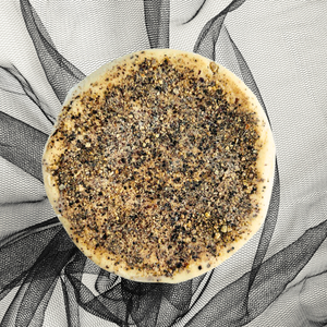Pepper Chevre cheese wheel