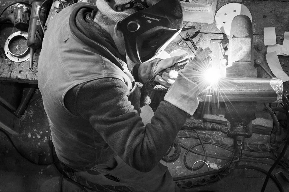 Beautiful recent b&amp;w shots by @alisonshaw around the boatyard: Brad welding, Ben hard at work on &ldquo;Summer Dawn,&rdquo; and Ross and Lyle pushing ahead with the new build. Winter on the calendar - full tilt in the shop.