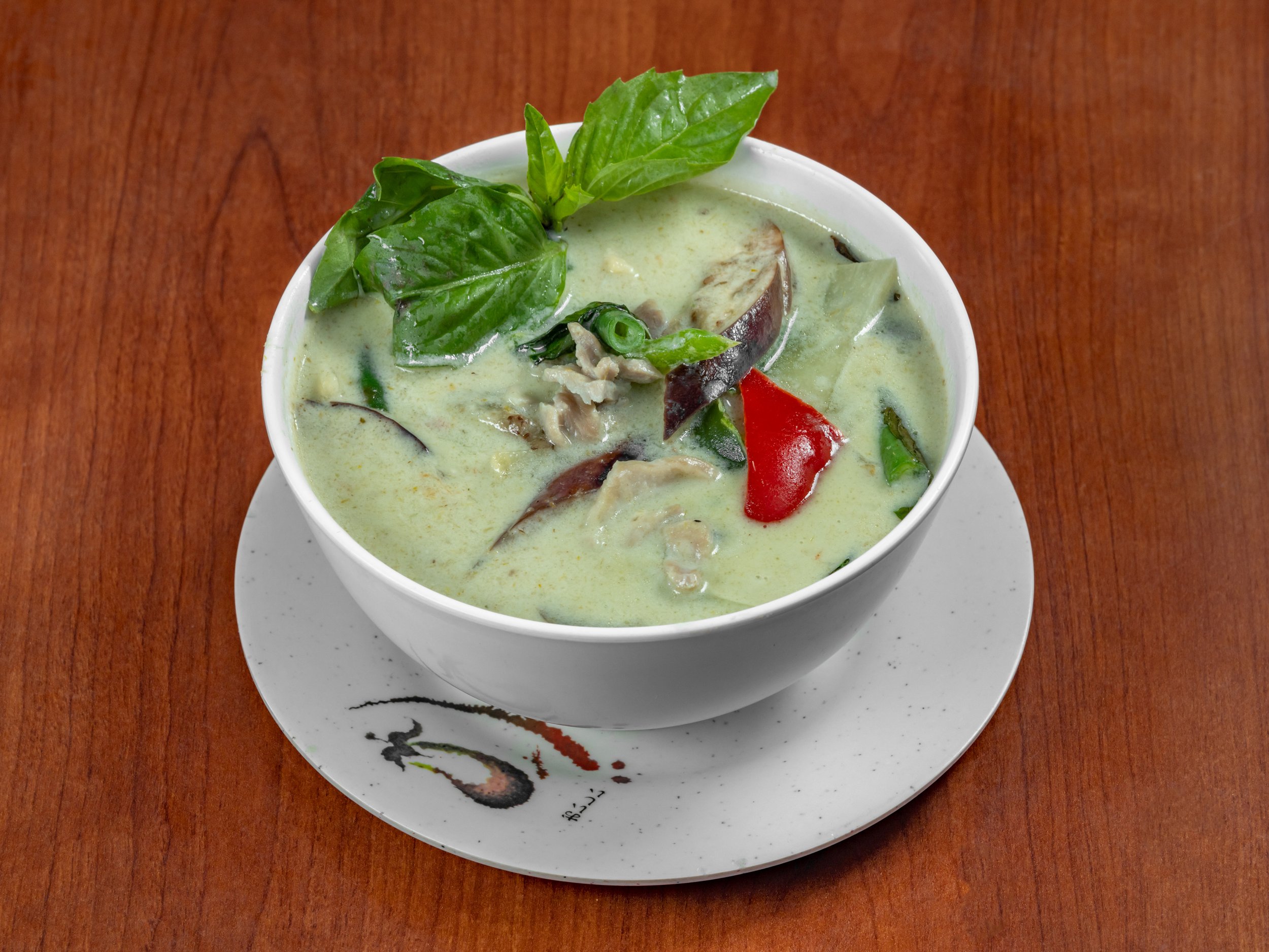 Thai green curry with a creamy coconut milk broth, aromatic green curry spices, fresh vegetables, Thai basil, and your choice of protein, served hot with bold, savory Thai flavors