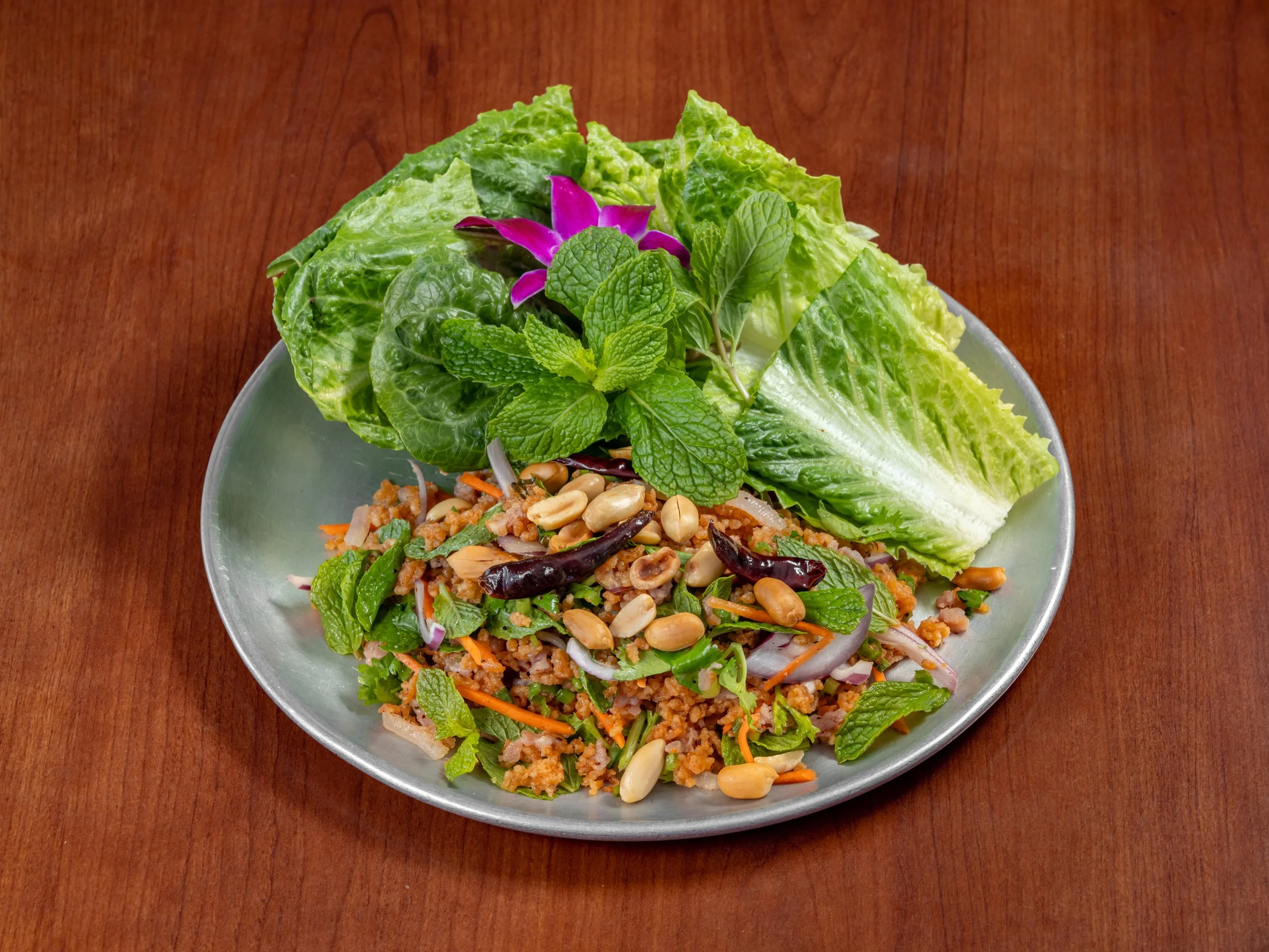 Thai crispy rice salad made with crunchy golden rice, fresh herbs, red onion, scallions, cilantro, lime, and a savory Thai-style dressing, tossed together for a bright, tangy, and crispy dish.