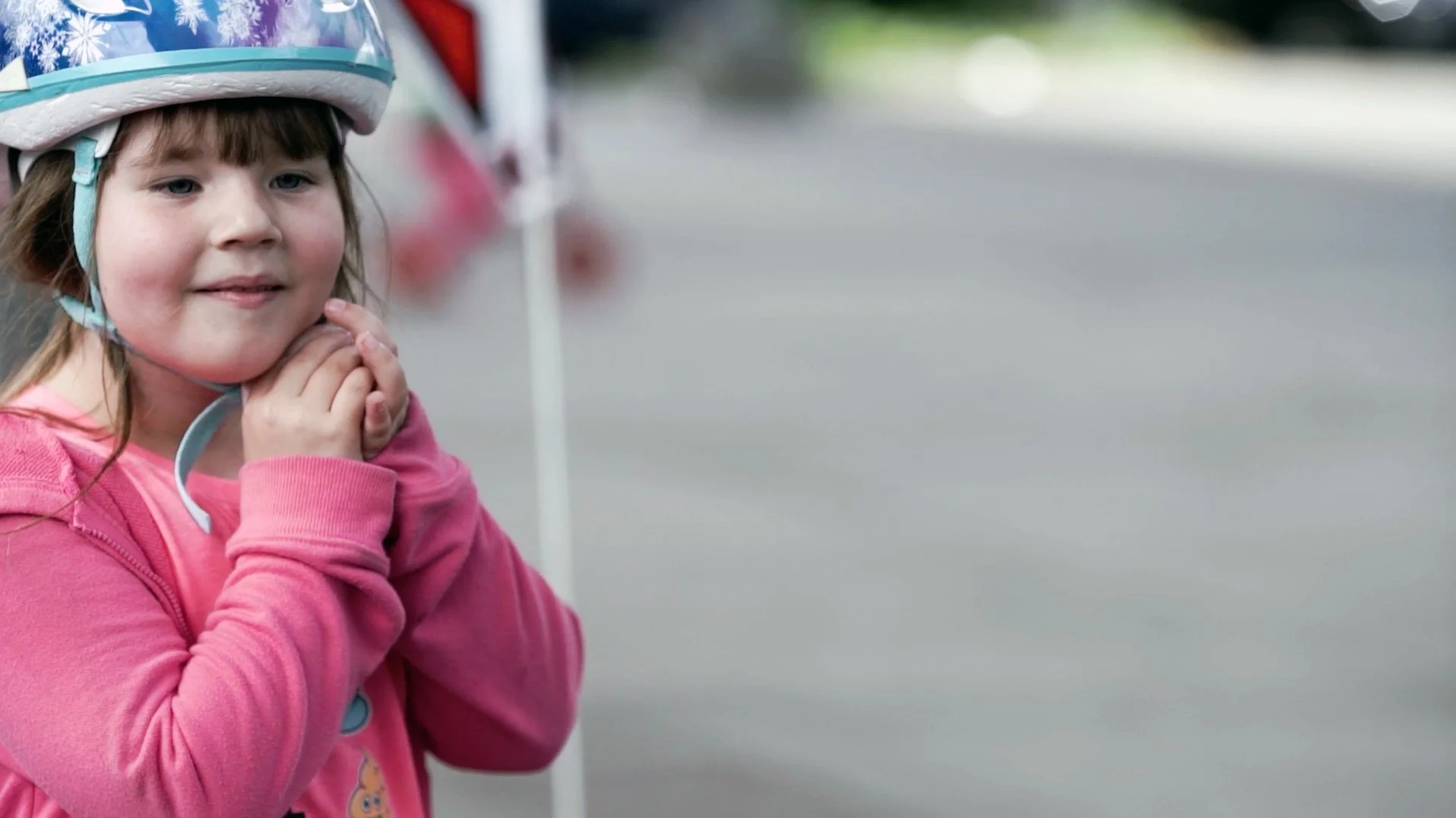 AWL-Year_End-Adaptive_Bike_Girl_Clasping_Helmet.jpg