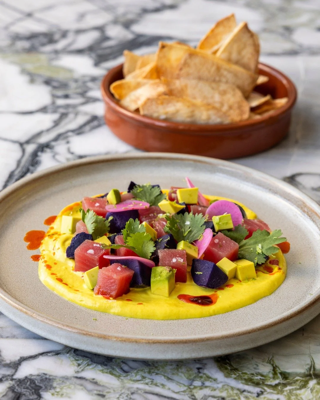 Crispy, zesty, tangy, fresh &mdash; our Ahi Tuna Ceviche checks all the boxes with crispy taro, avocado, aji amarillo, yam, pickled onion, and cilantro oil. 🤤

#high5iverooftop #uptownoakland #visitoakland #oaklandbars #bayareabuzz #bayareanightlife