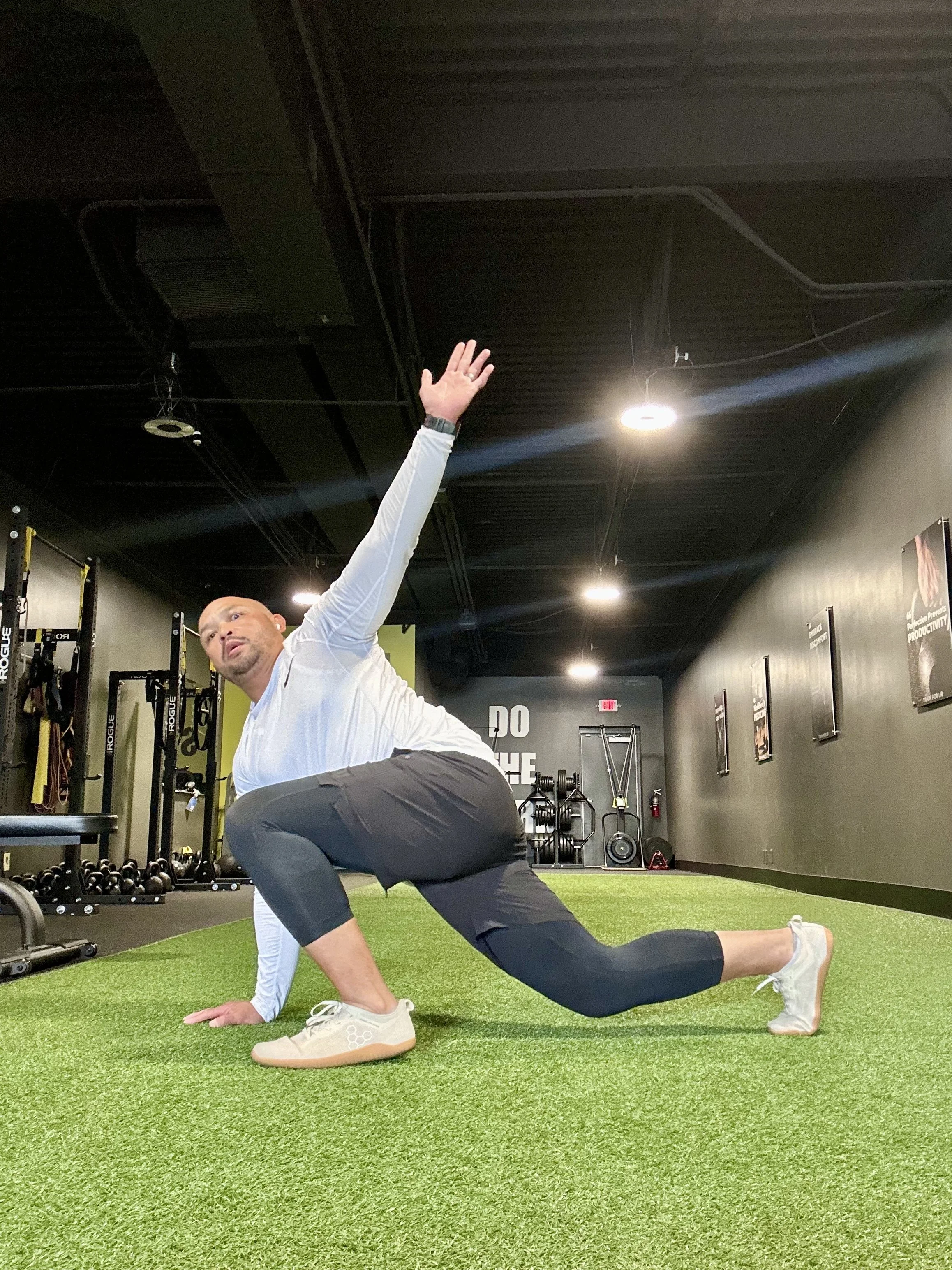 Tony Muyco III performing mobility and recovery exercises at Functional Elements Training & Nutrition in Creve Coeur, Missouri.