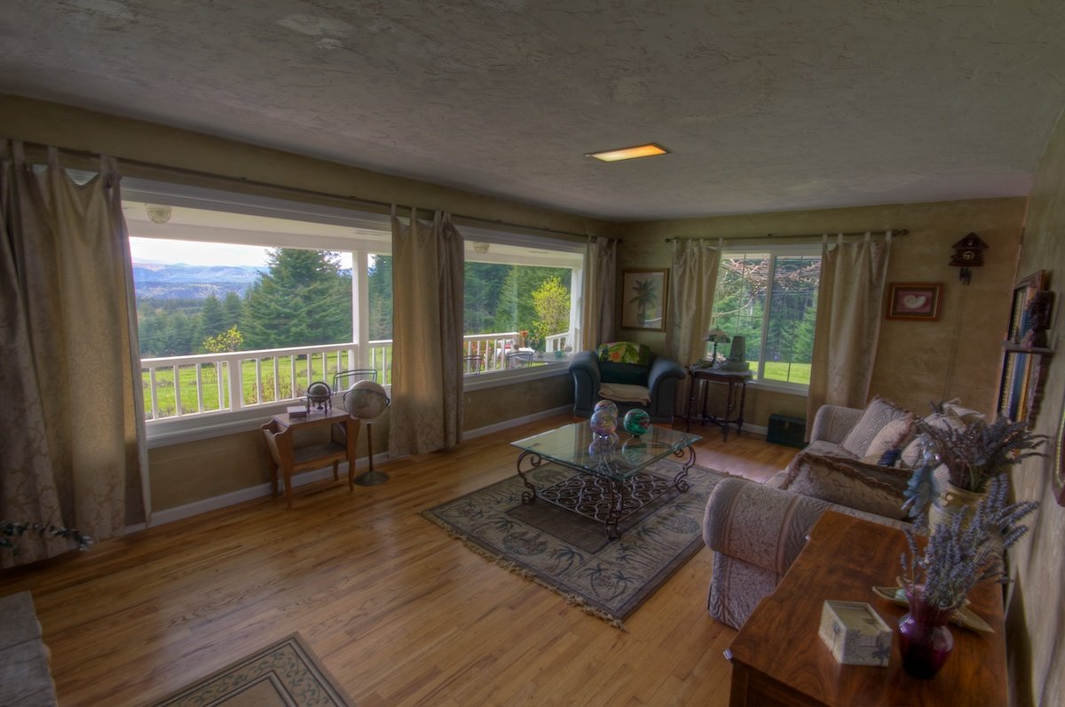 Bay windows in a living room of a house for sale in Buxton, Oregon