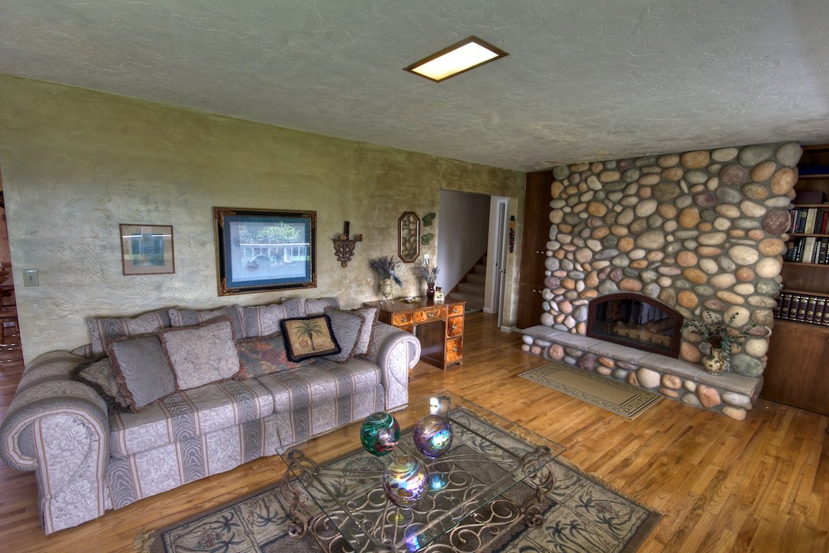 Living room with fireplace in a house for sale in Buxton, Oregon
