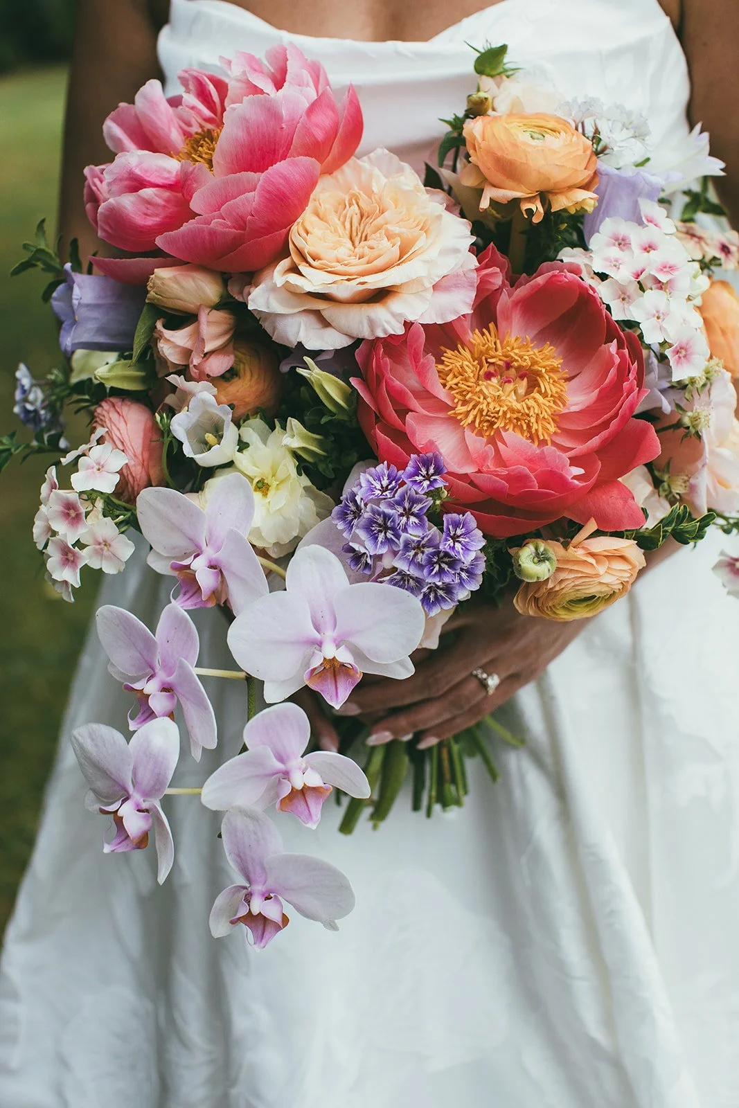 Colorful wedding bouquet held by Maui bride