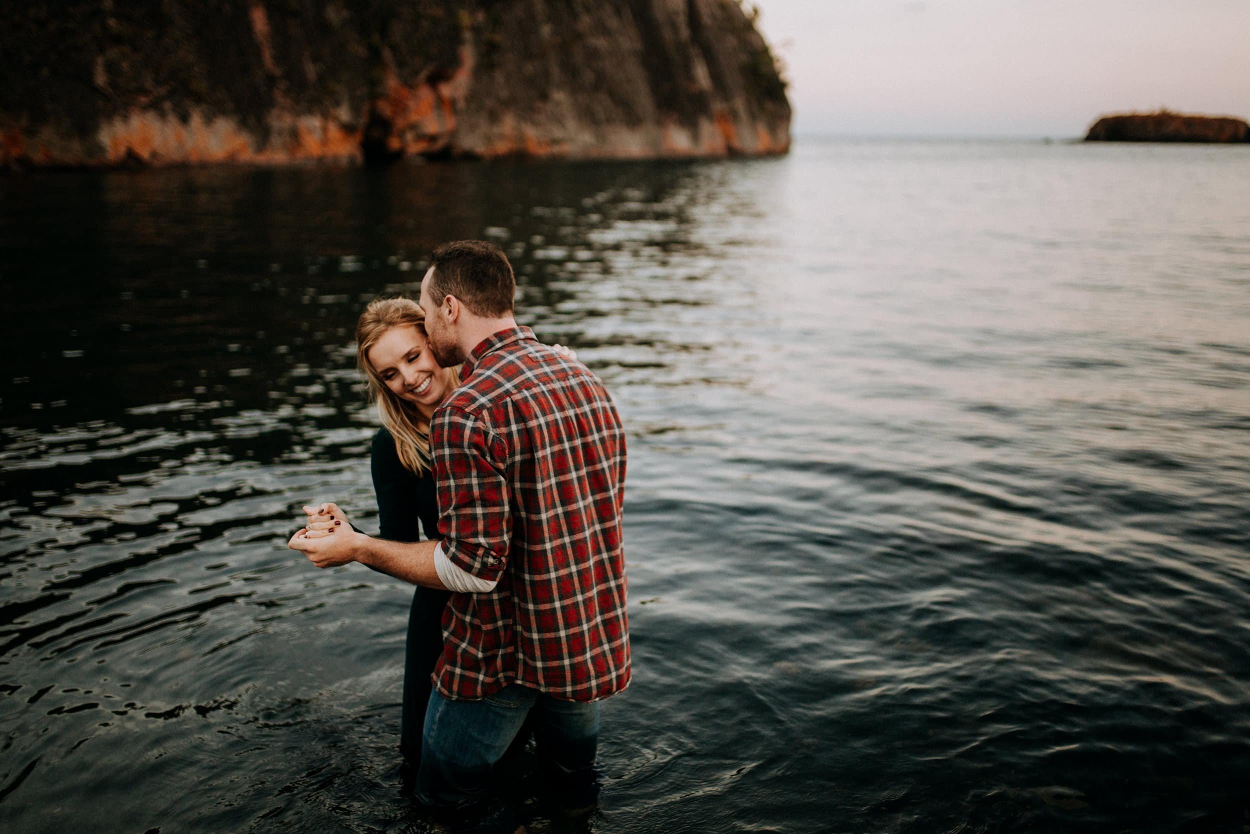 Black-Beach-MN-Engagement-photos-in-lake-superior-splashing-Narrowleaf-love-and-adventure-photograph.jpg