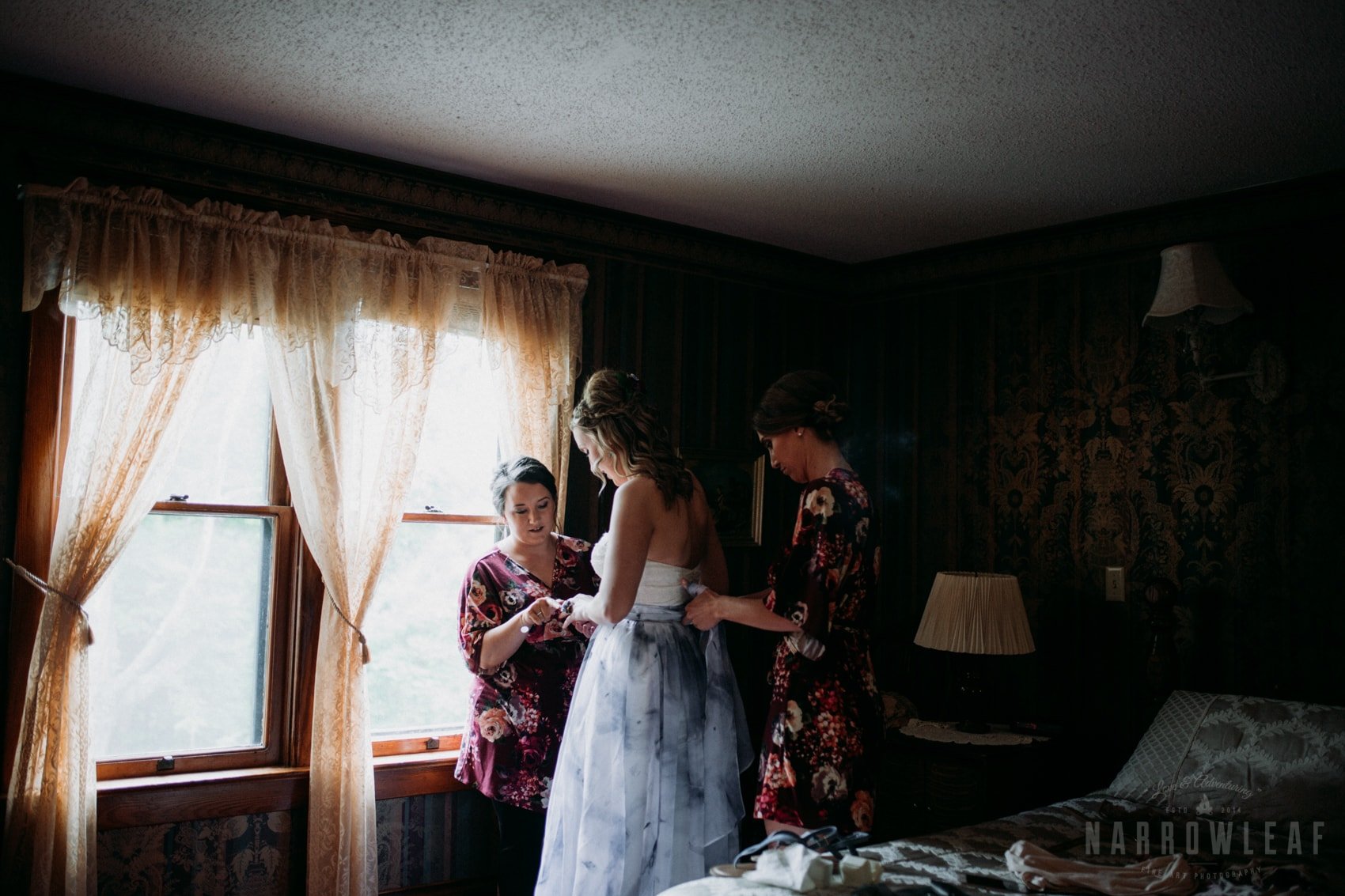 bayfield-wi-wedding-bride-getting-in-her-dress-302.jpg.jpg