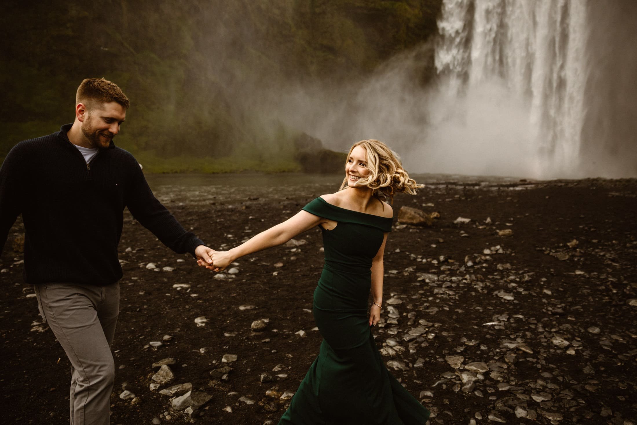A lady in a green dress leading her fiancé_y. Having just got engaged the night before_ these two are having a grand Icelandic adventure to celebrate_.jpg