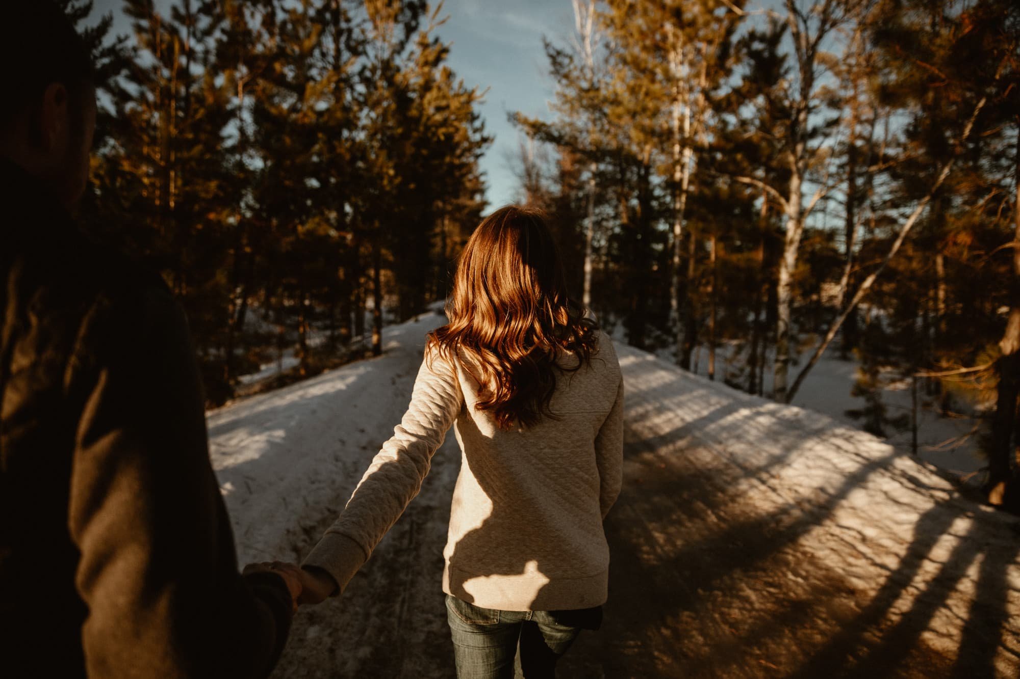 Woman leading her fiancé through the woods on_yythk..jpg