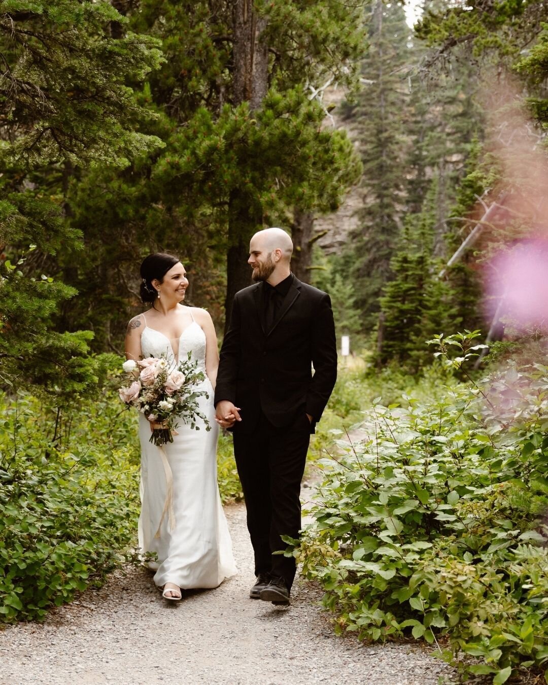 B &amp; P's Glacier National Park Wedding Highlights!⁣
⁣
From their private vows in Glacier's iconic meadow along the Going to the Sun Road, their hike with their bridal party to an insane vista view, their alpine lake wedding ceremony, to their inti