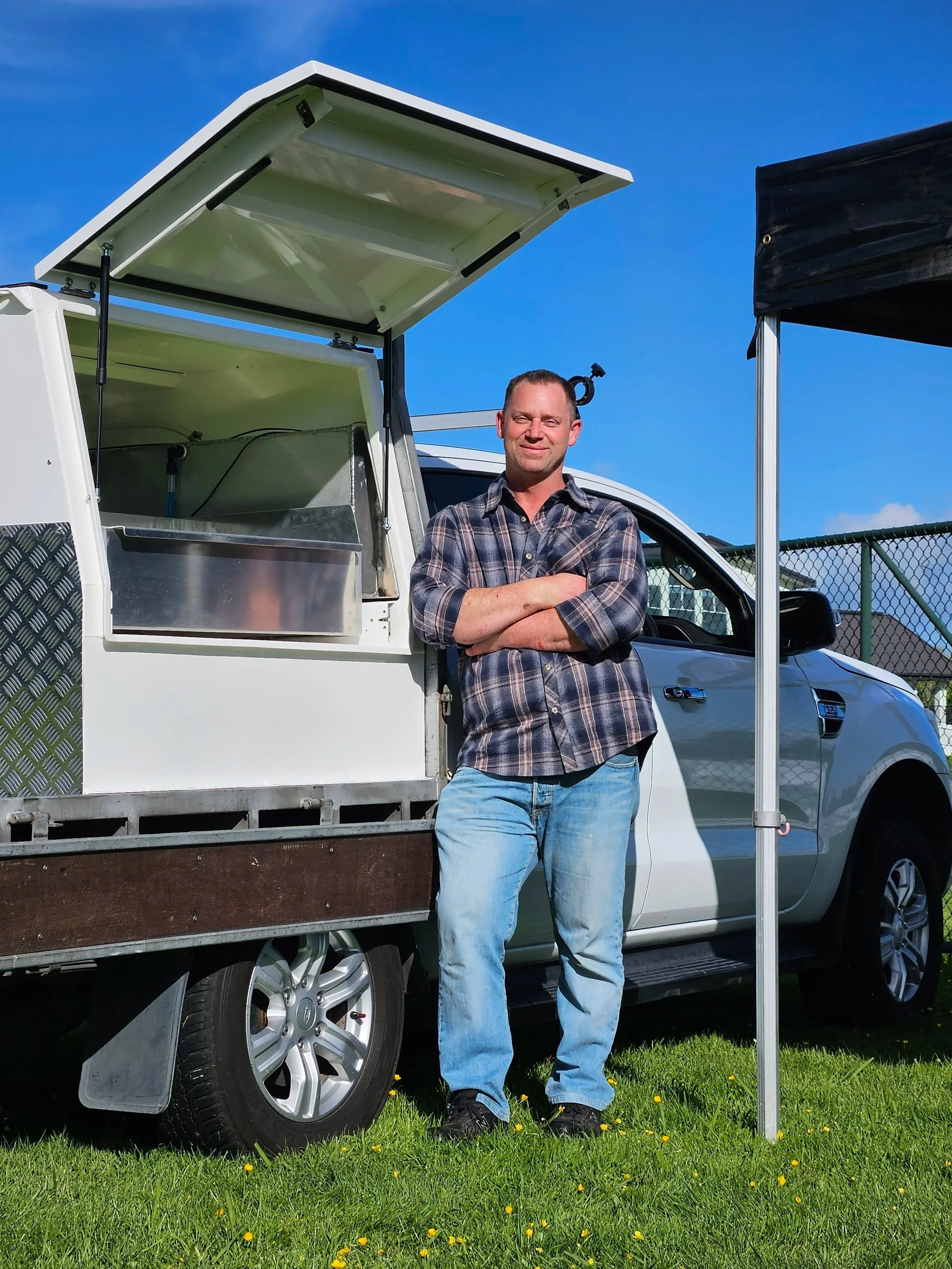 Steve, founder of AMFS, leaning against a custom-built Service Box