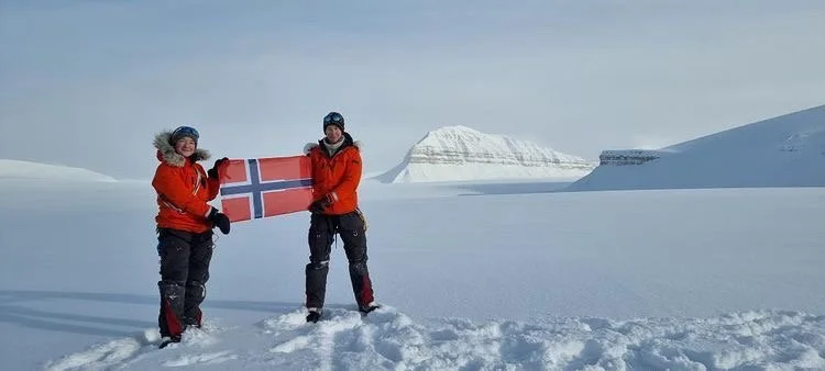 Dr. Sevestre and Climate Sentinels in Svalbard with Norwegian Meltdown Flag
