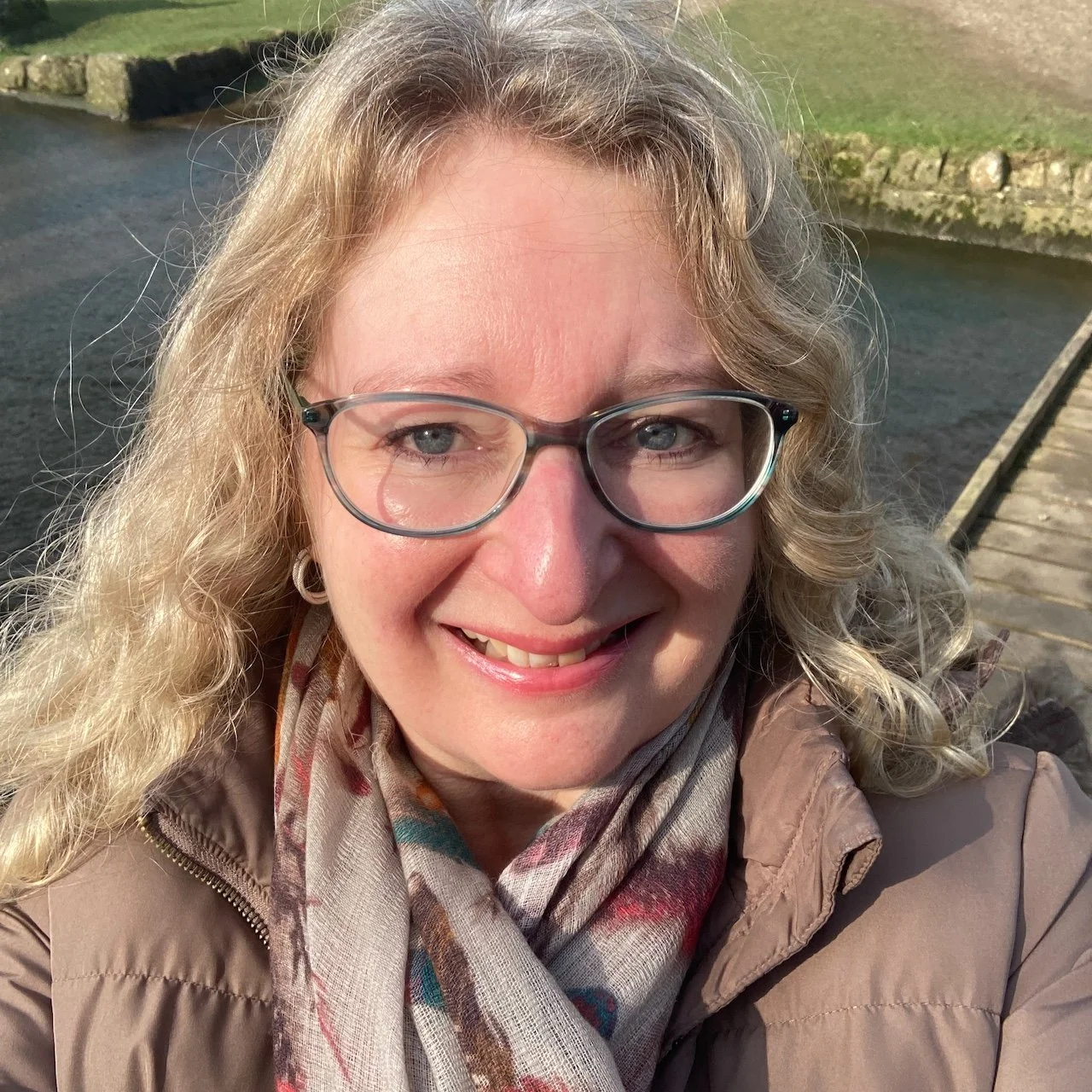 Jane Hinchliffe smiling in the sunshine.jpeg