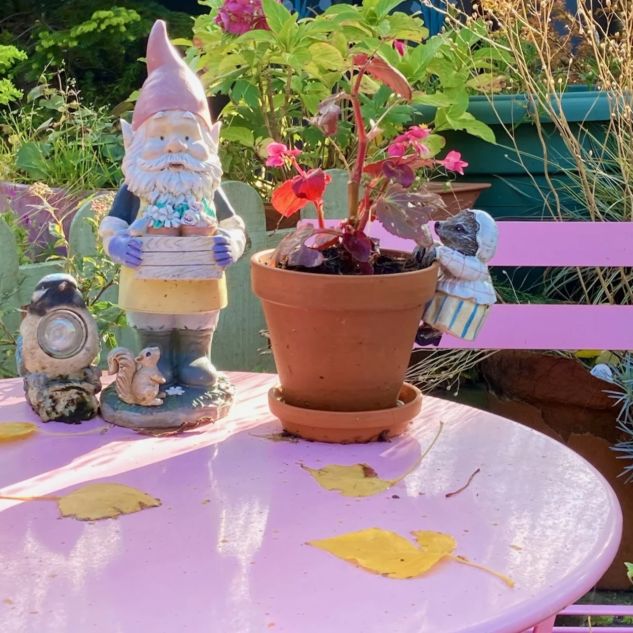 Outdoor table with plant garden characters.jpeg
