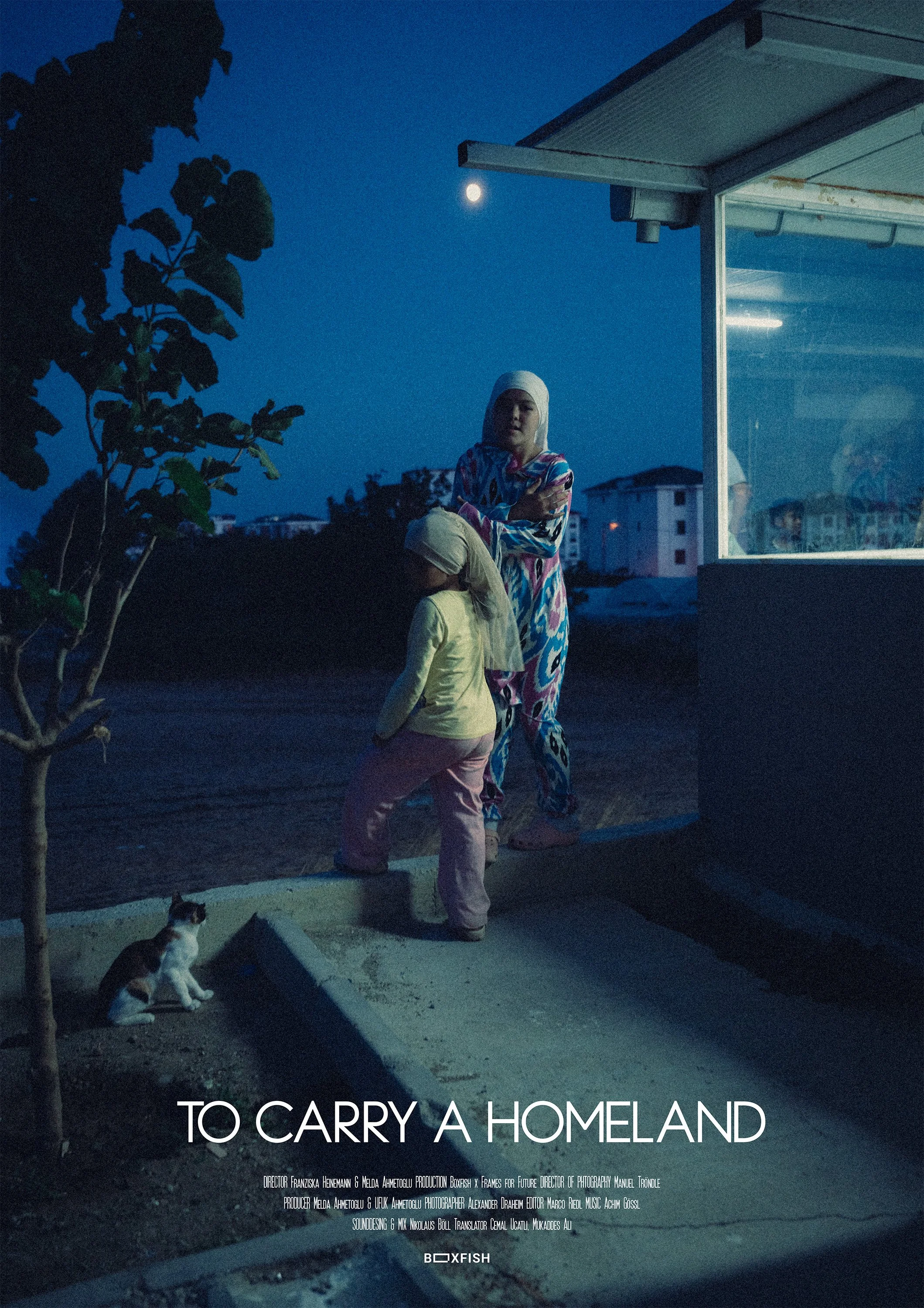 A woman and a child stand outside at night near a building with a glass window, under a bright moon. The woman is dressed in colorful clothing and the child wears light-colored clothing and a headscarf. A small dog sits nearby on the ground, and there is a tree on the left side.