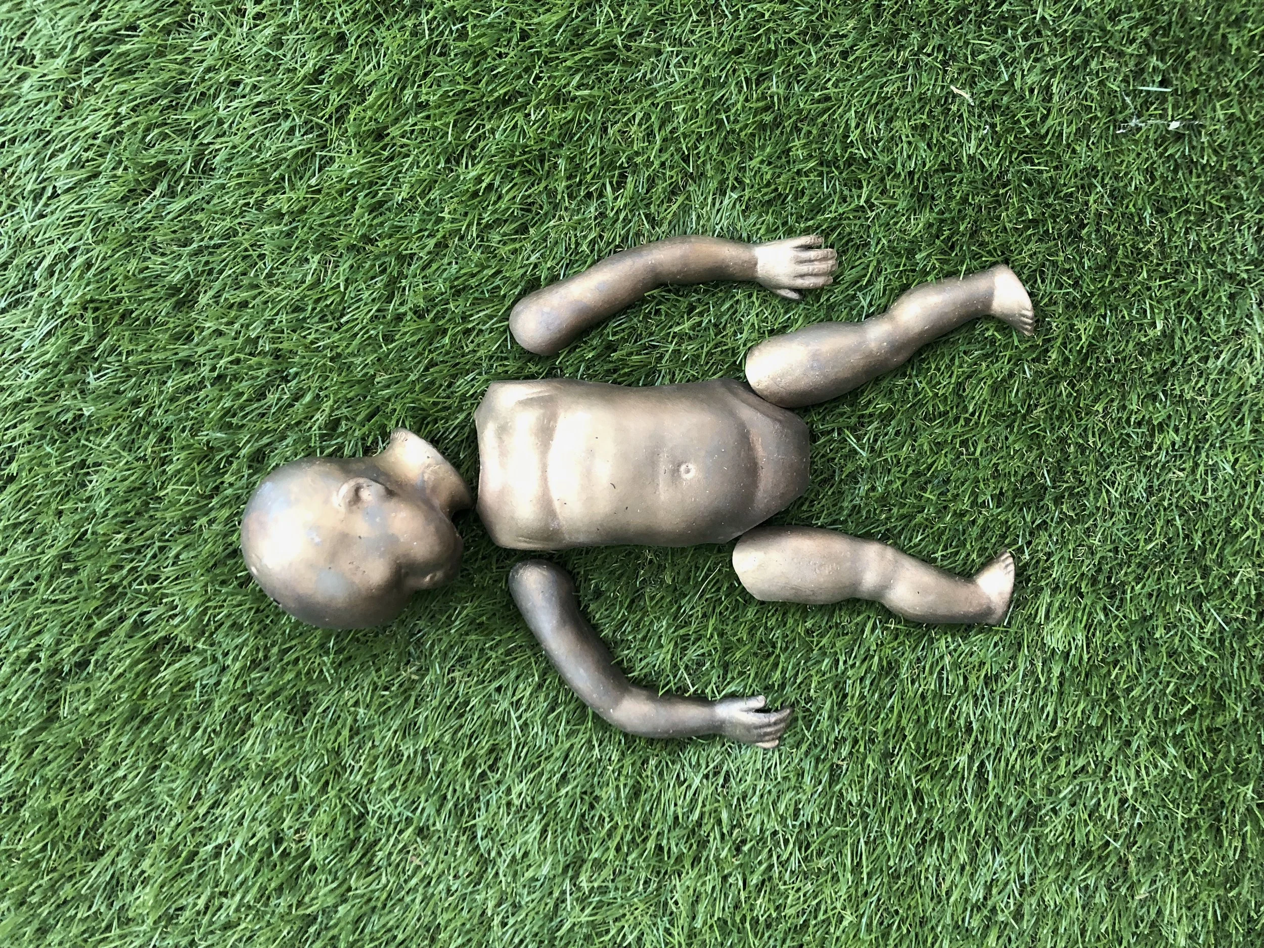 doll baby, bronze