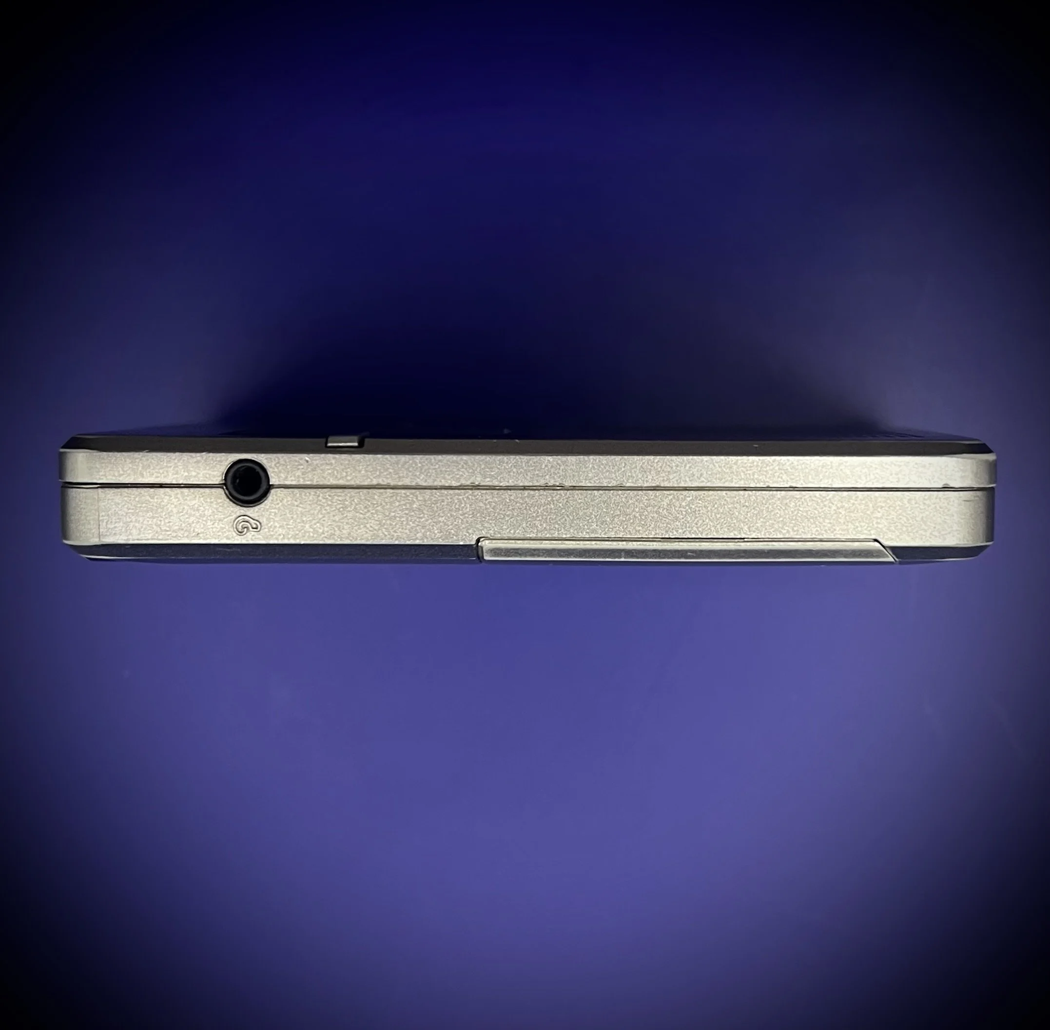 Panasonic RR-DR60 digital voice recorder port view - blue background