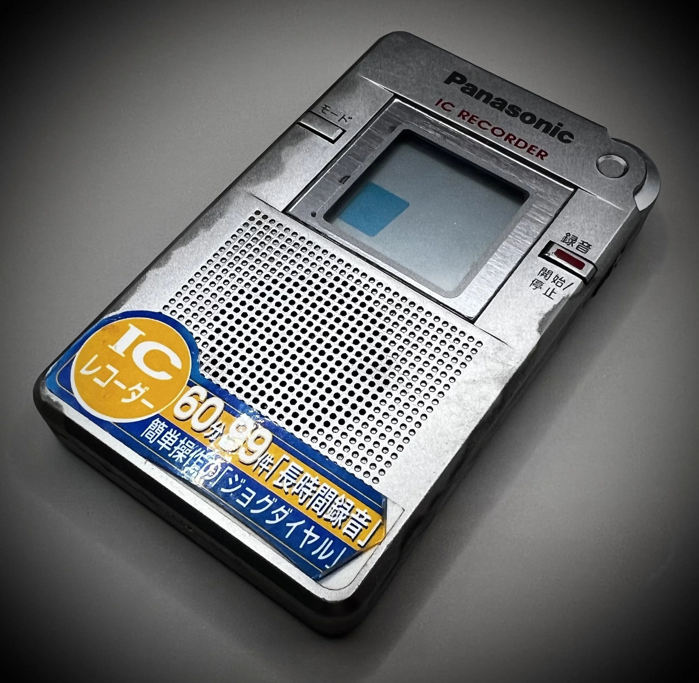 Panasonic RR-DR60 digital voice recorder right perspective view - grey background