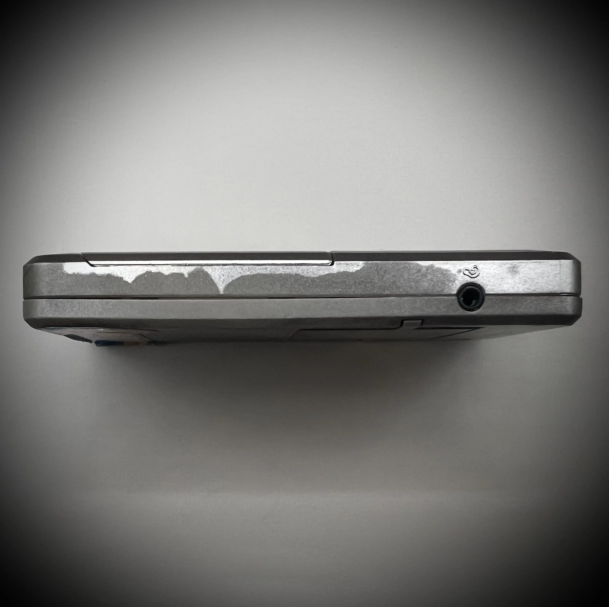 Panasonic RR-DR60 digital voice recorder port view - grey background