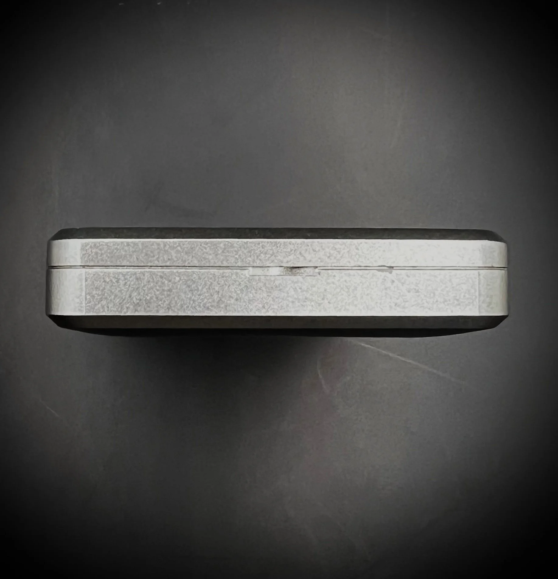 Panasonic RR-DR60 digital voice recorder bottom view - black background