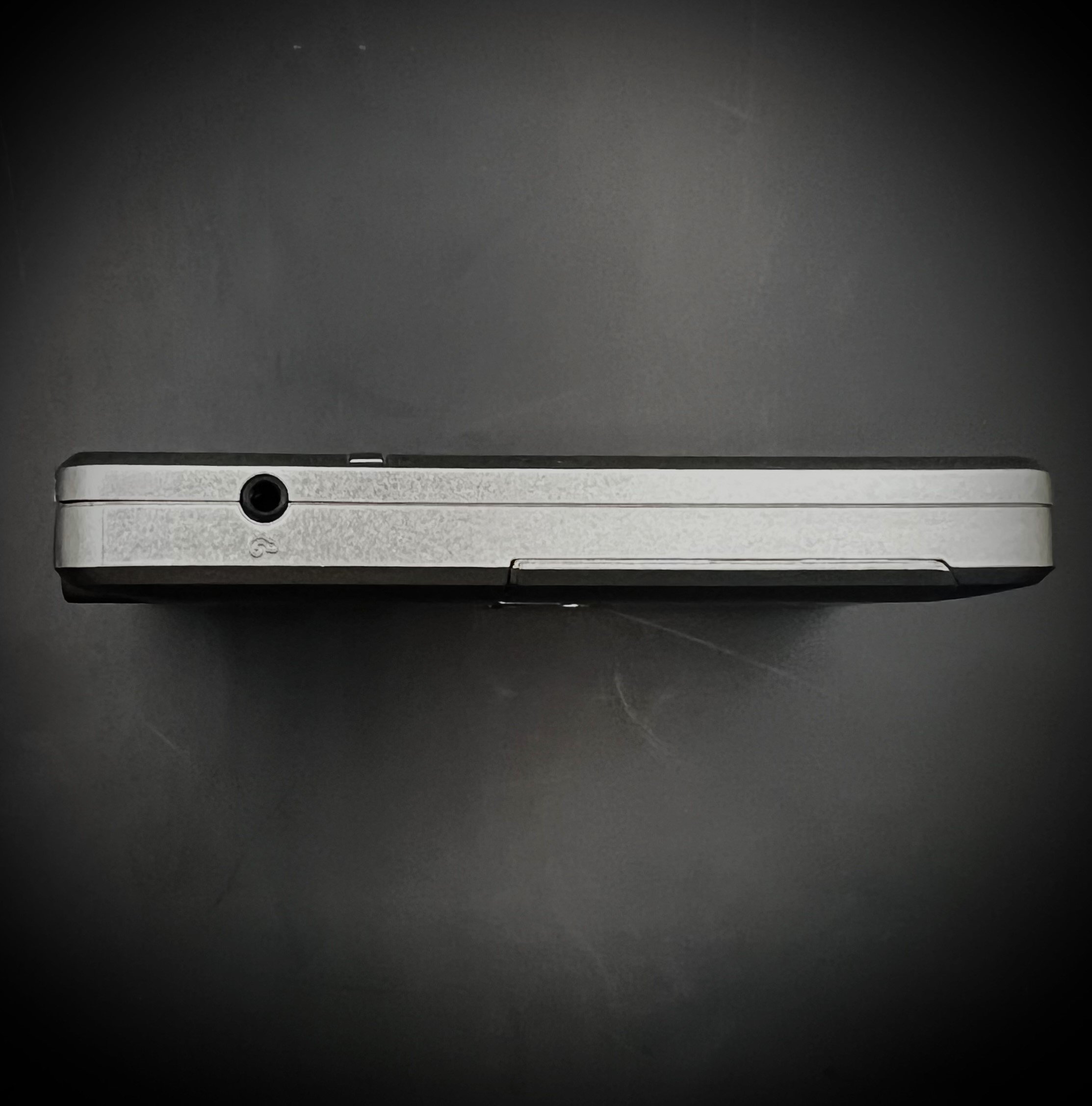 Panasonic RR-DR60 digital voice recorder port view - black background