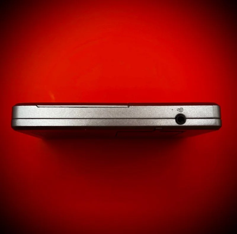 Panasonic RR-DR60 digital voice recorder port view - red background