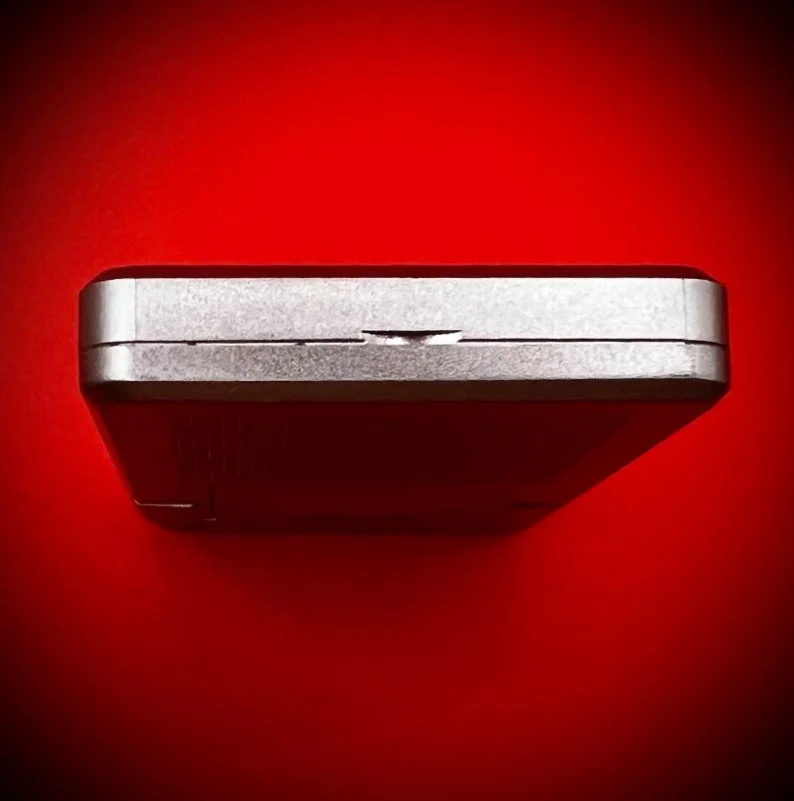 Panasonic RR-DR60 digital voice recorder bottom view - red background