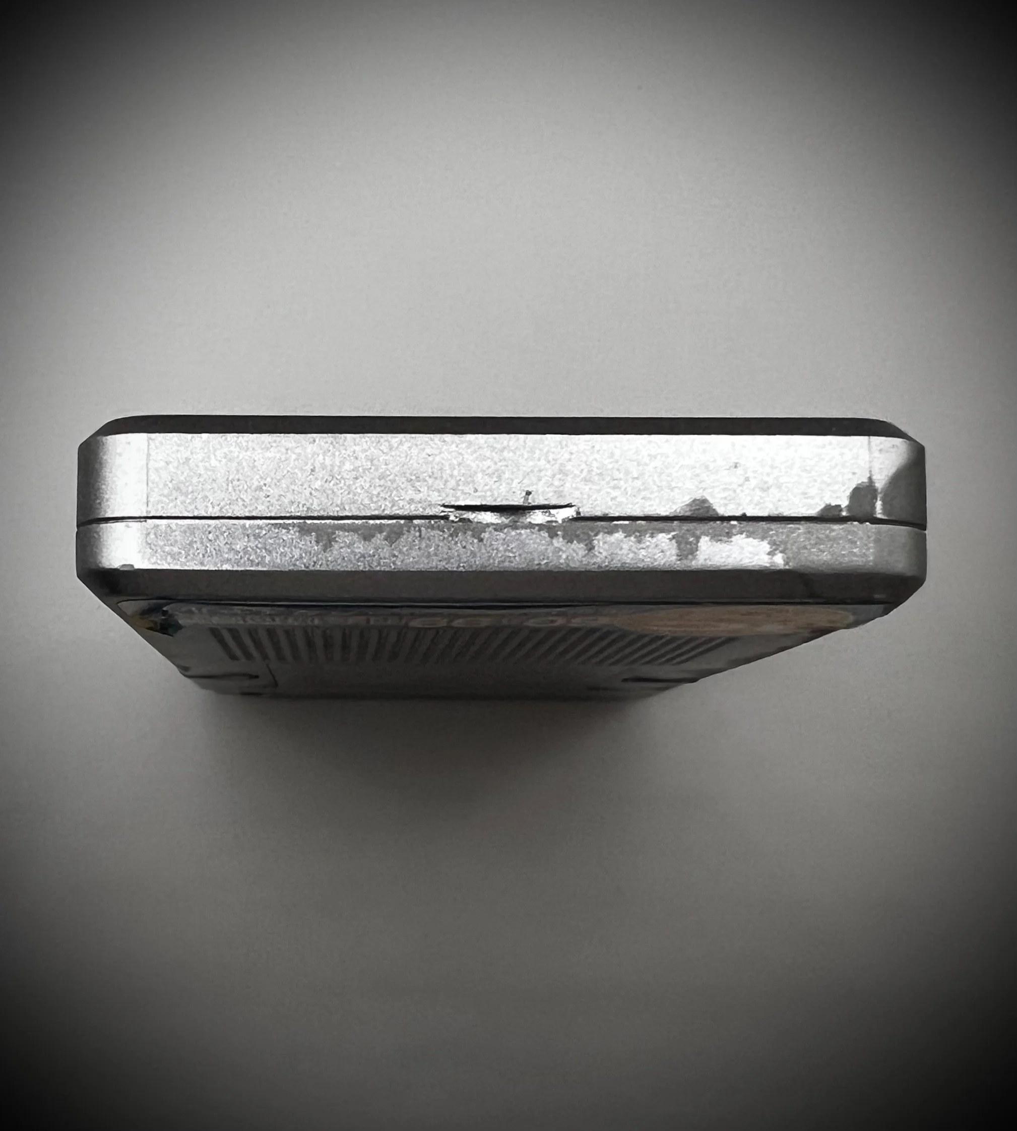 Panasonic RR-DR60 digital voice recorder bottom view - grey background