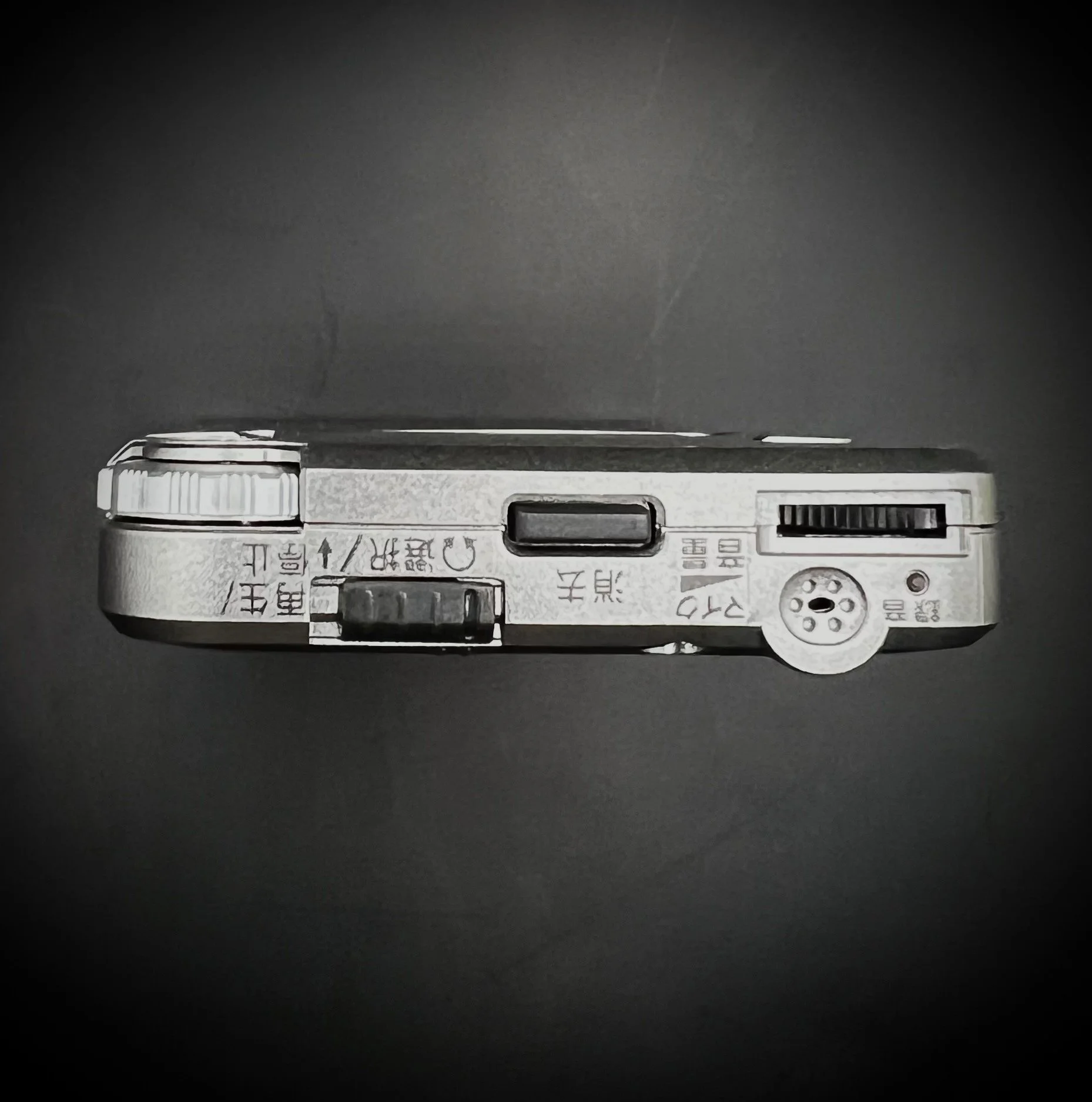 Panasonic RR-DR60 digital voice recorder top view - black background