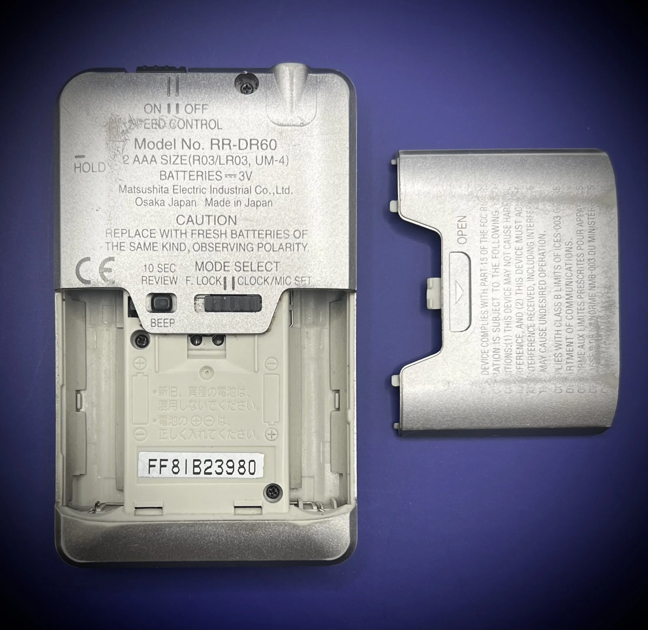 Panasonic RR-DR60 digital voice recorder serial number view - blue background