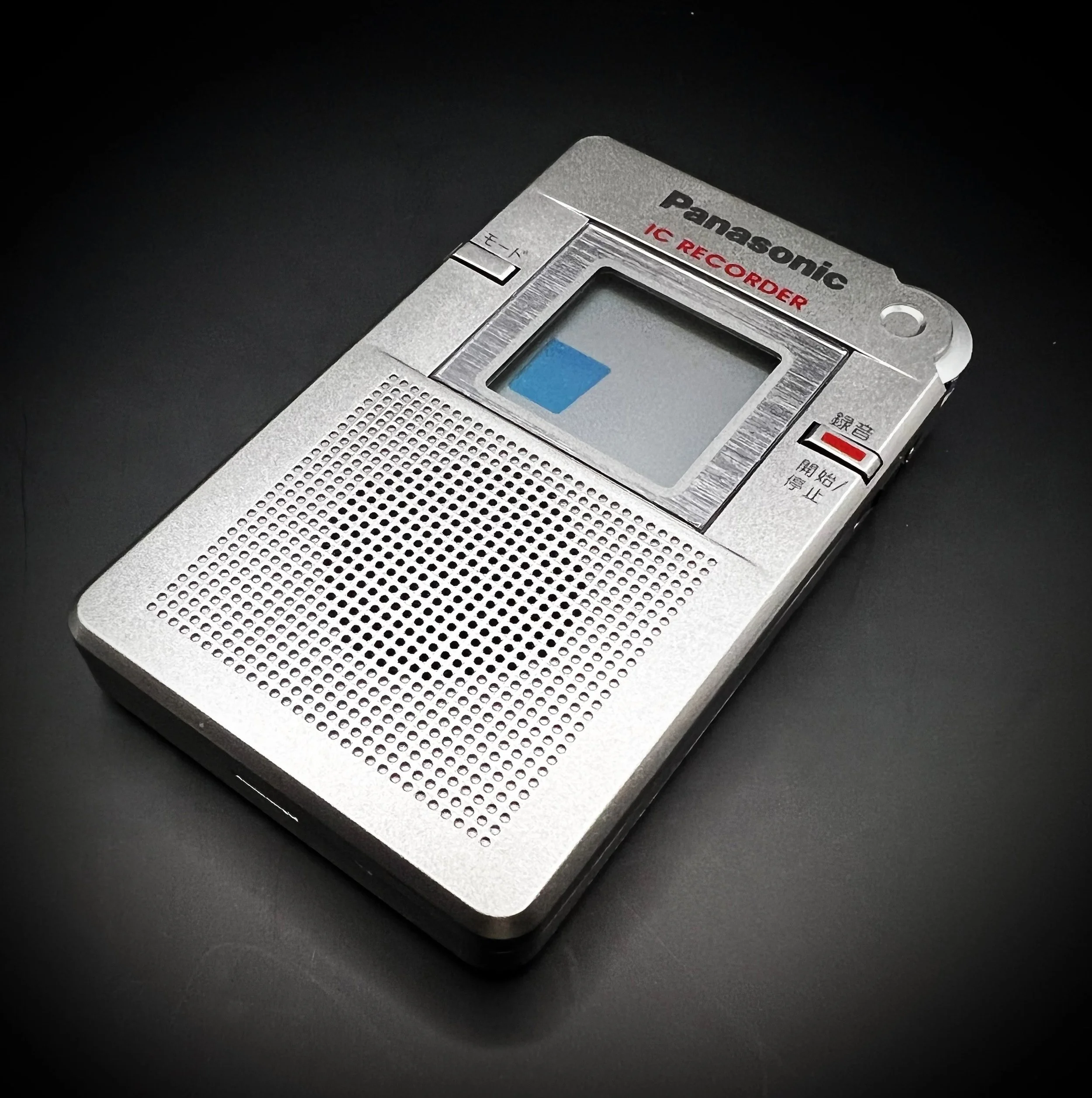 Panasonic RR-DR60 digital voice recorder right perspective view - black background