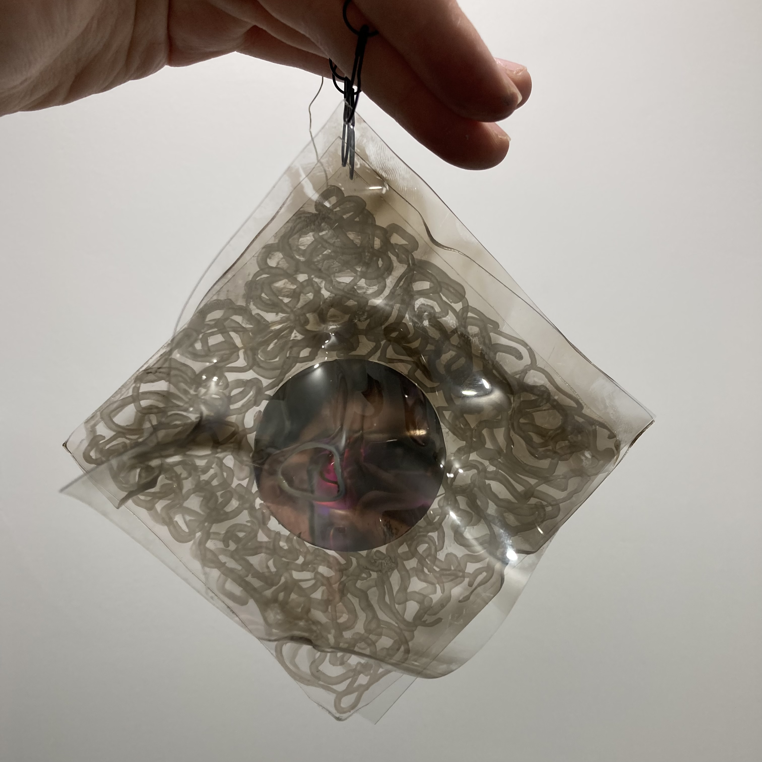 weird suncatcher ii, plastic, mirror, paint and smoke, 2022