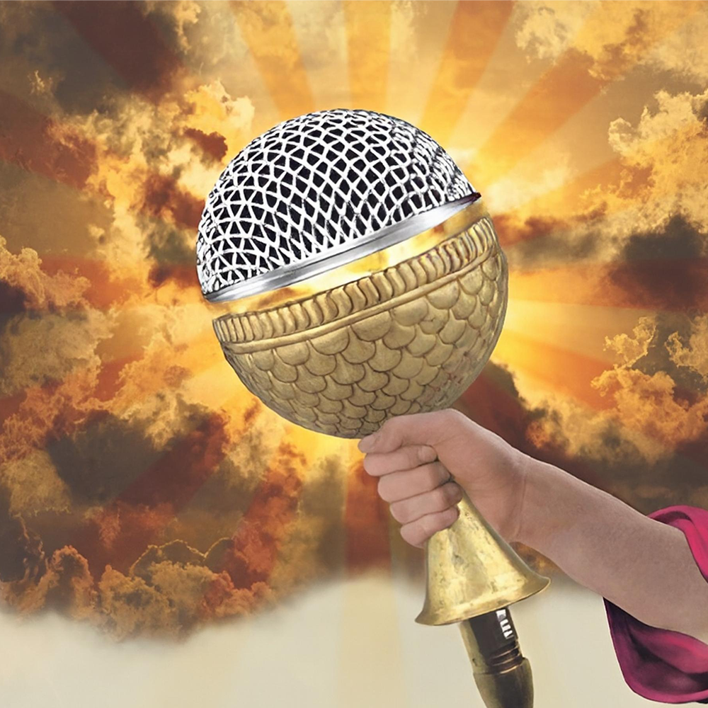 A hand holding a microphone with a globe-shaped top against a background of a fiery sky. Promo artwork for the Epic Comedy Showcase in Berlin Mitte.