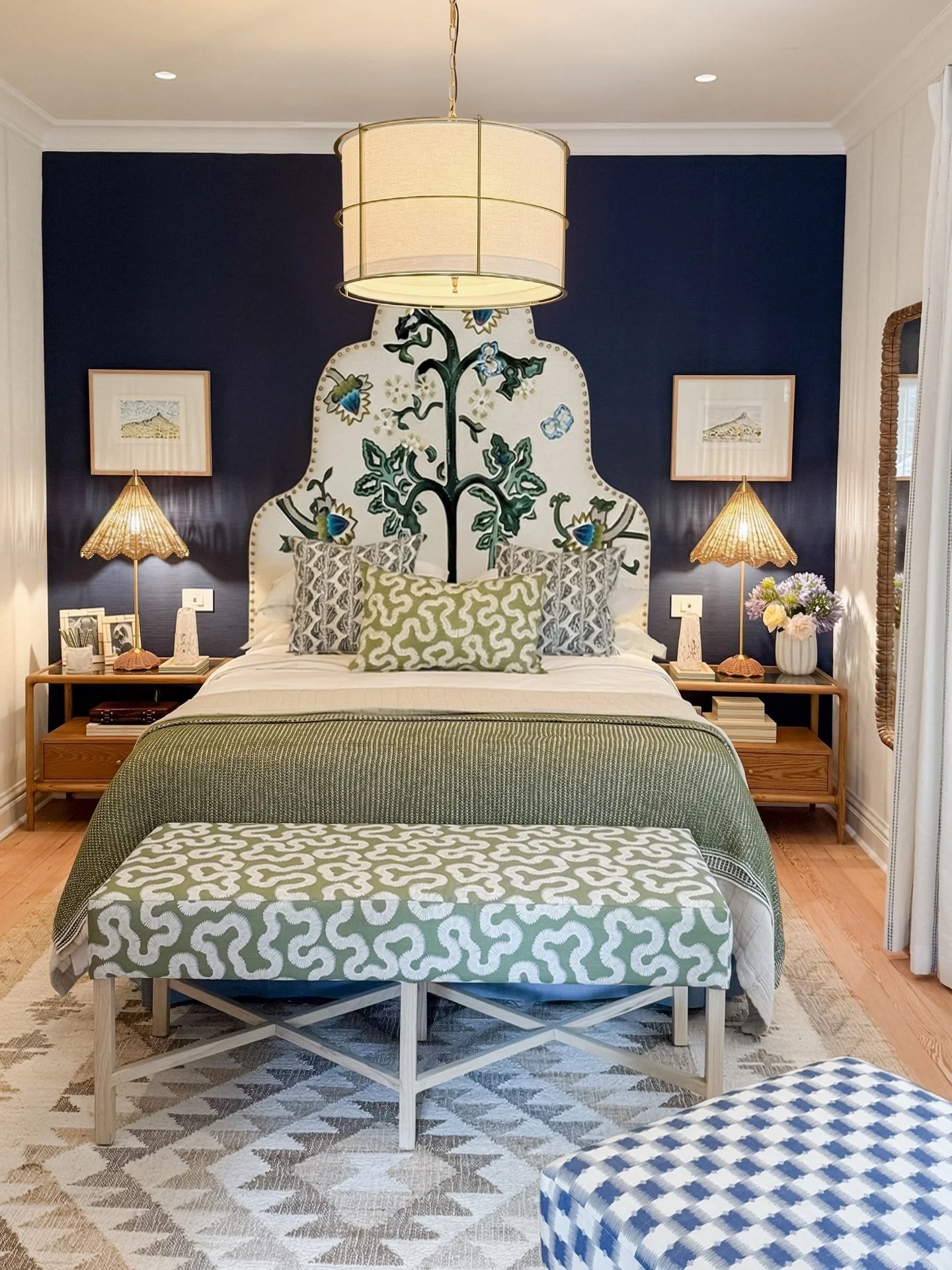 One of our favorite bedroom renovations and redesigns to date. 
We designed the custom botanical headboard against the moody navy wall so it would &lsquo;pop&rsquo; - bringing the peacefulness of the beautiful gardens outside -  inside. Layer upon la