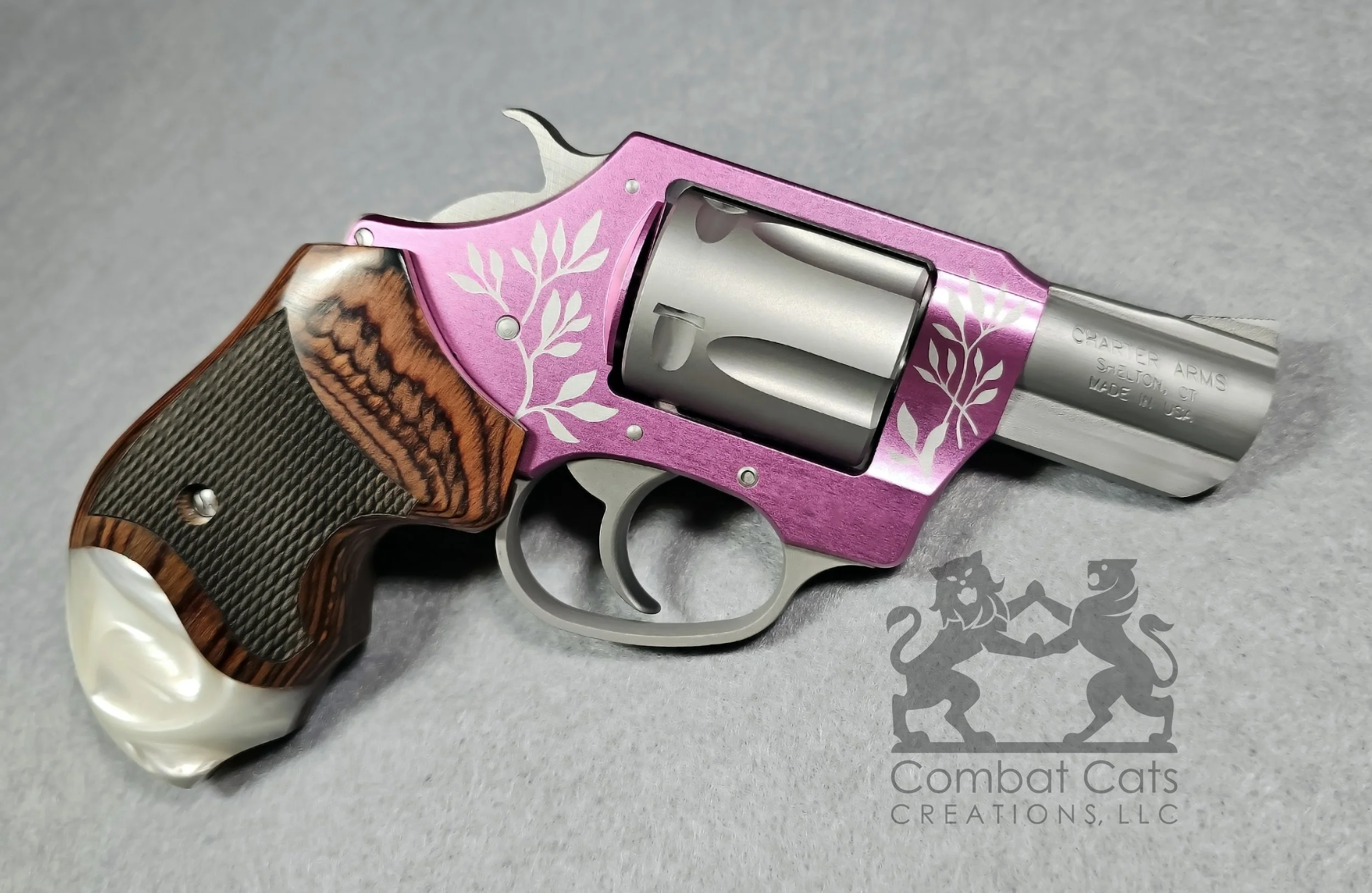 Custom botanical laser engraving on a Charter Arms Pink Lady.